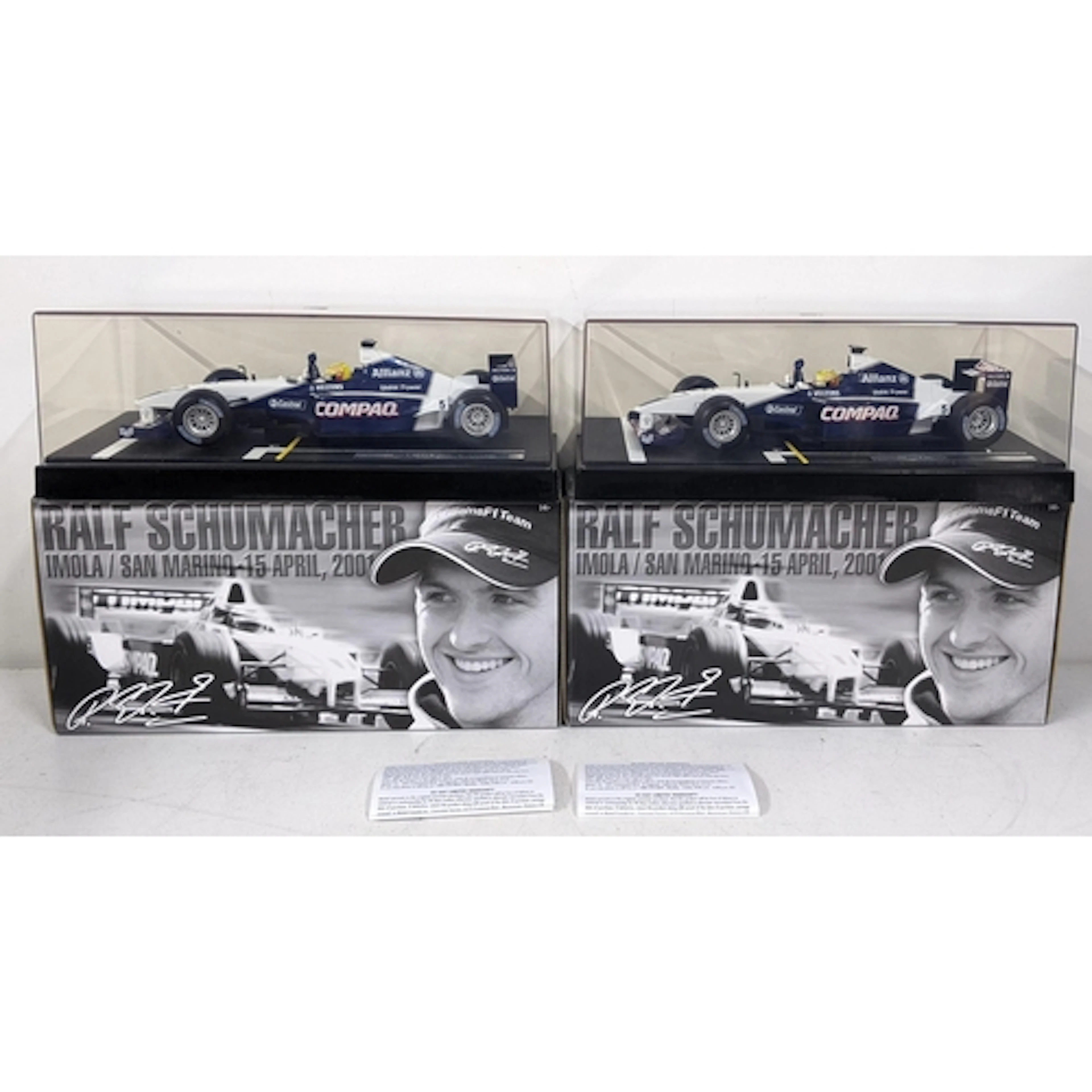 Two Hot Wheels racing models of the 2001 Williams F1 car dri...
