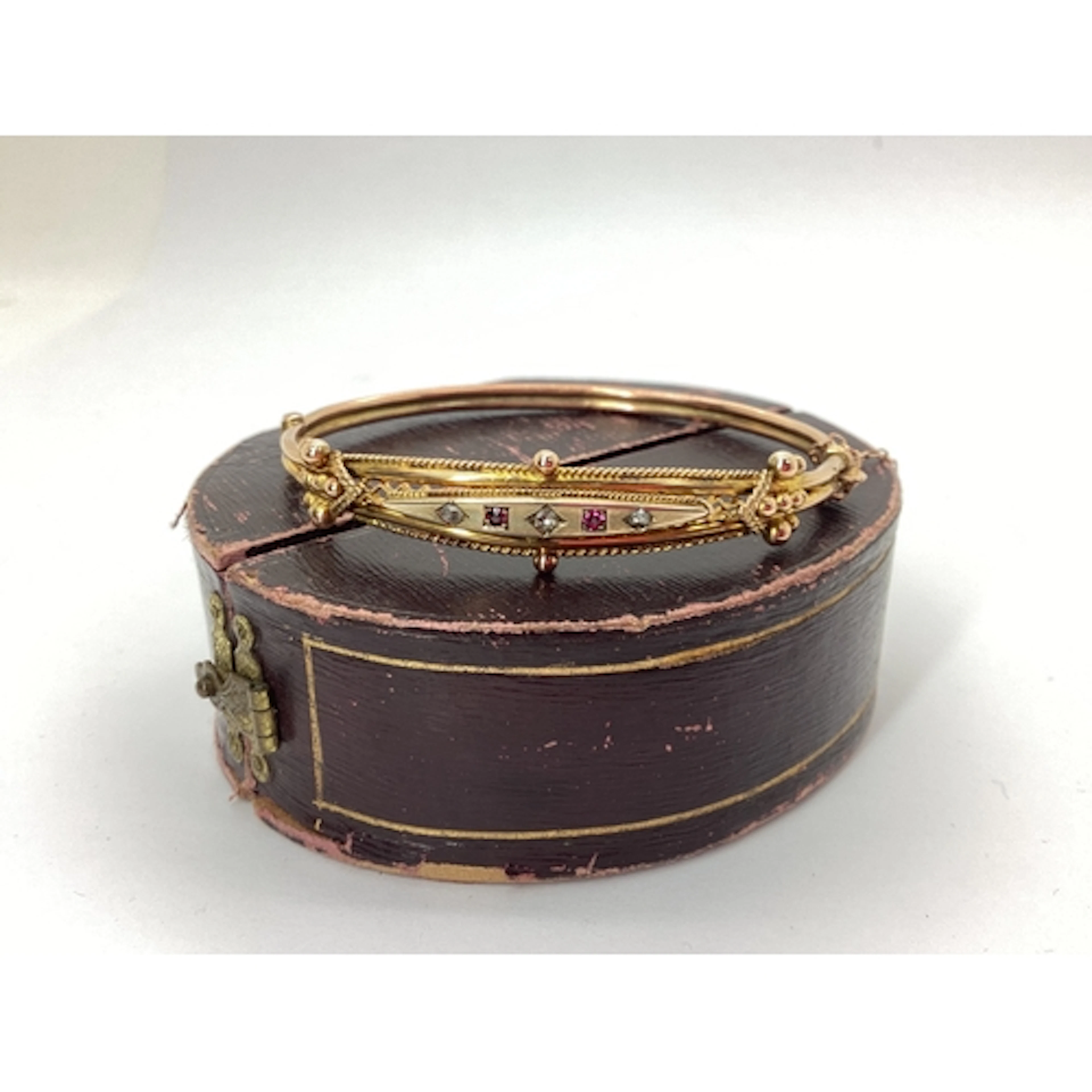 An Edwardian Ruby and Diamond Set Hinged Bangle, of intricat...