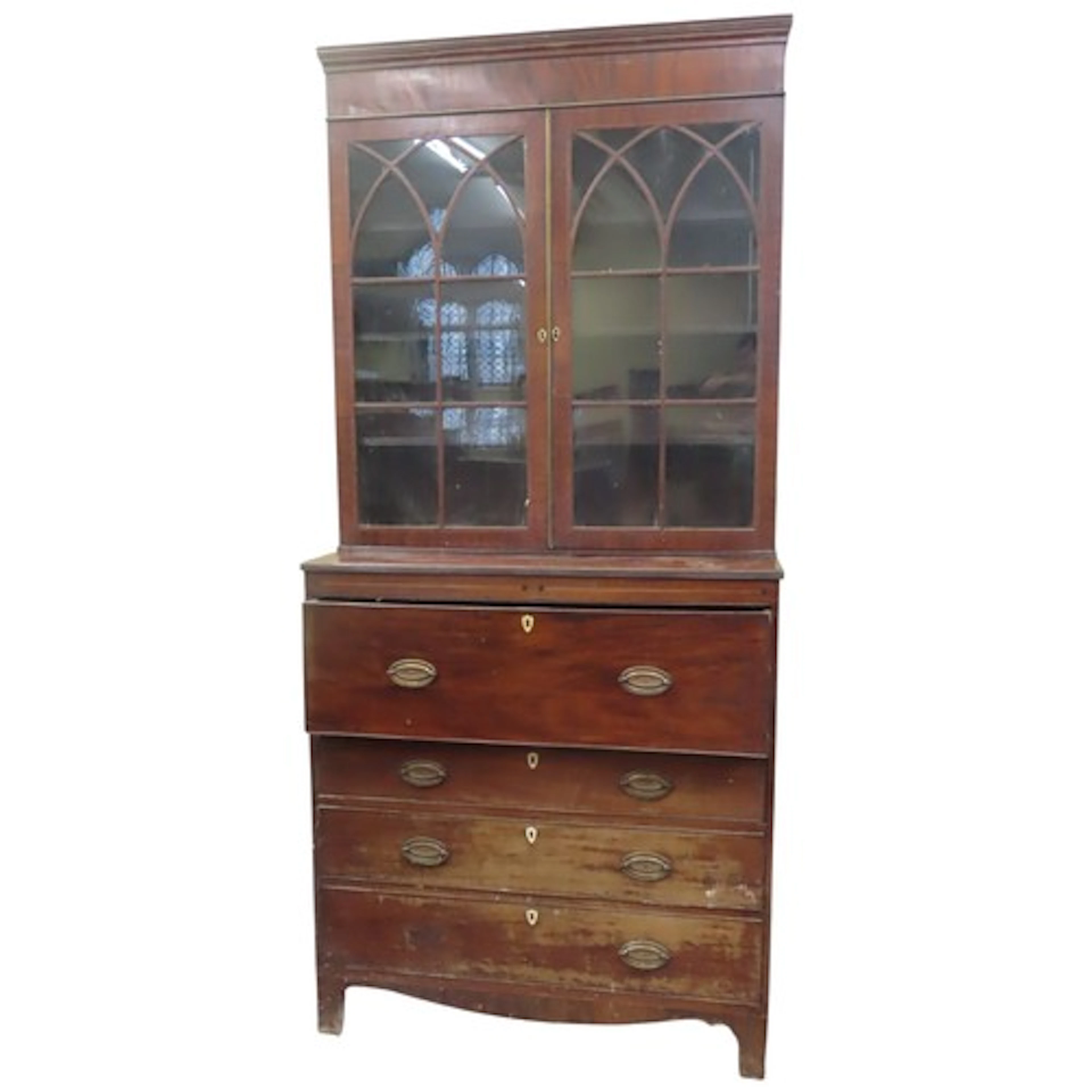 A Regency mahogany secretaire bookcase, the lower section pr...
