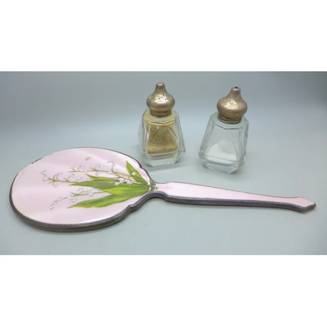 A silver hand mirror with floral guilloche enamel decoration...