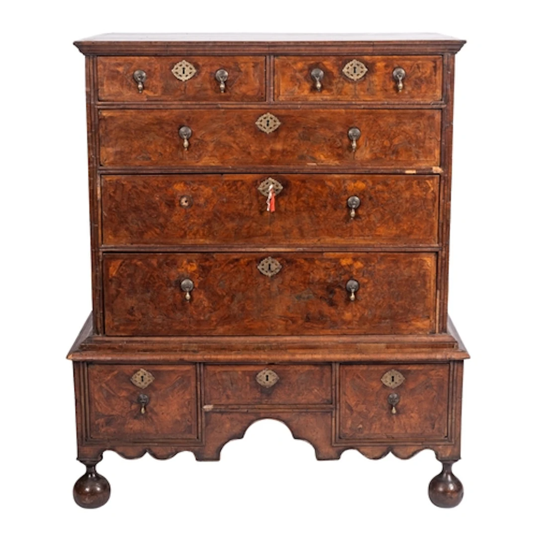 A late George I or George II walnut and feather banded ches...