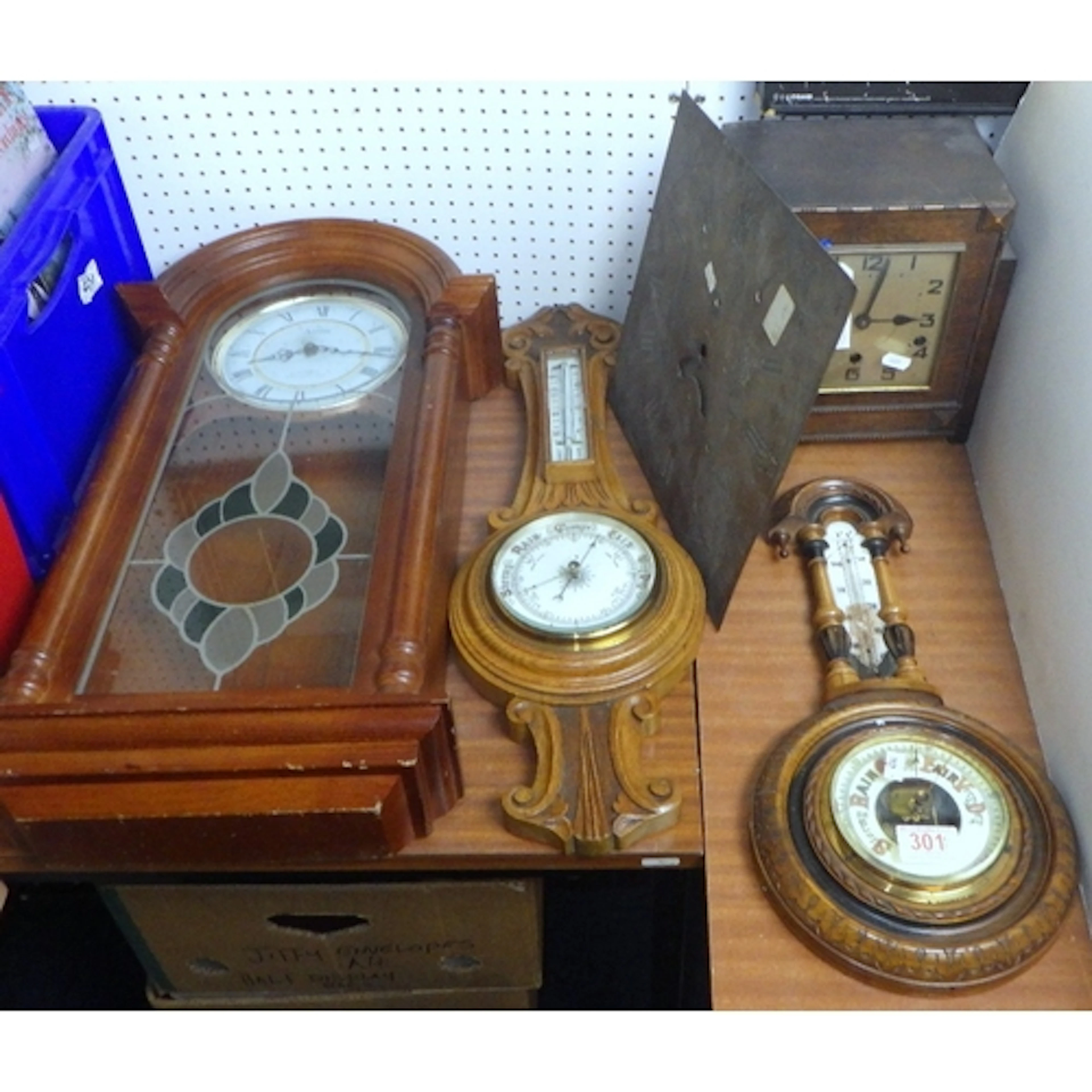 Two barometers, a wall clock, mantle clock and a Longcase br...