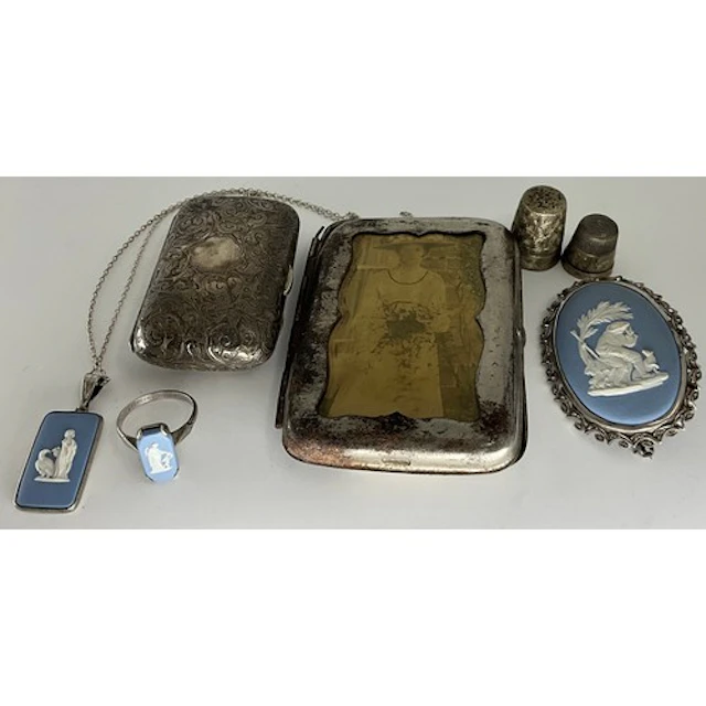 A Victorian silver lady's coin purse, profusely chased with ...
