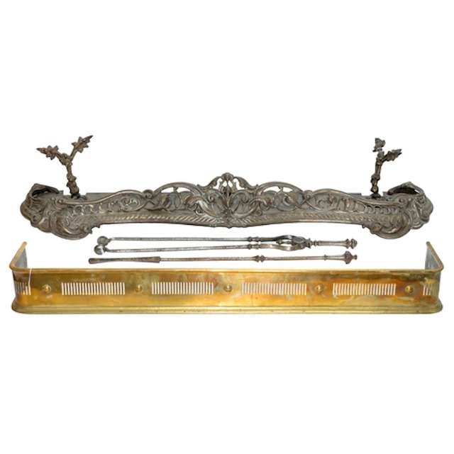 A cast iron fender, probably French, mid 19th c, of scrollin...
