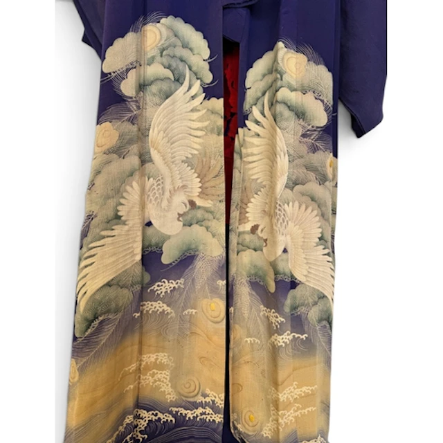 A 20TH CENTURY JAPANESE SILK KIMONO Decorated towards the ba...