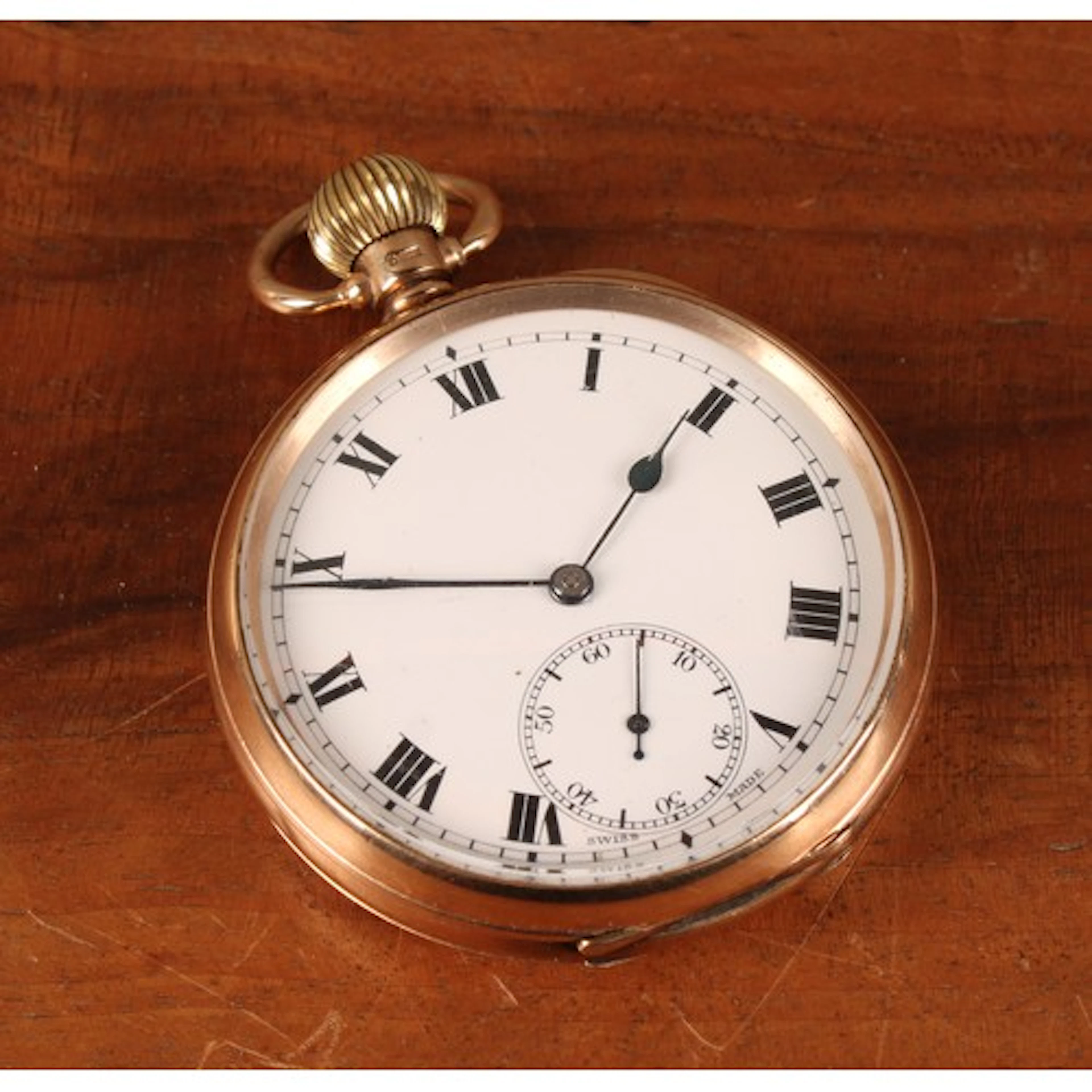 Local Interest - a 9ct gold open face pocket watch, white en...