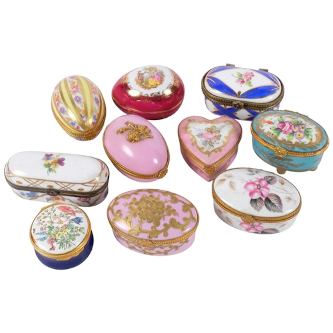 A collection of 8 porcelain trinket boxes, including Limoges...