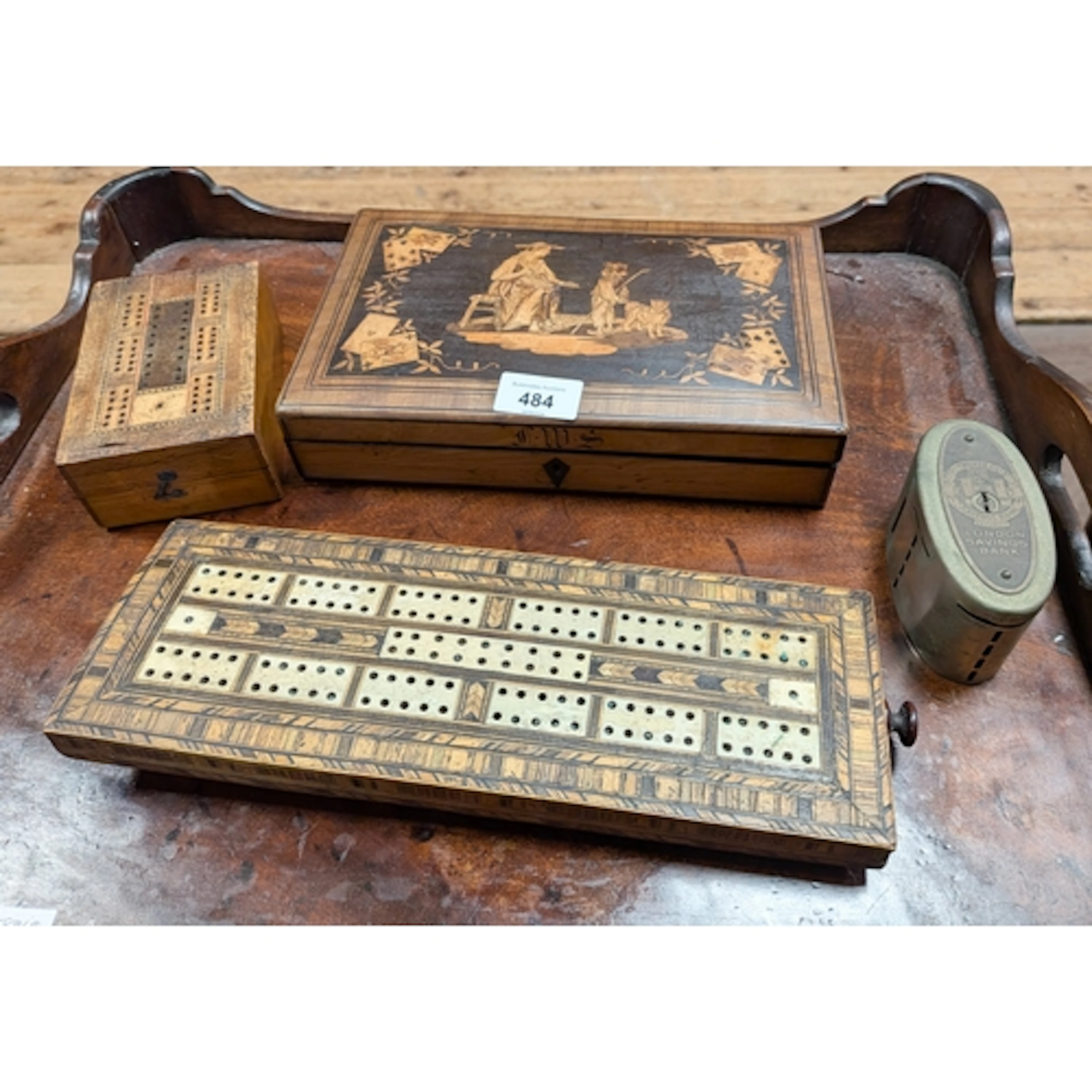 An antique Tunbridge ware inlaid bone crib scorer together w...