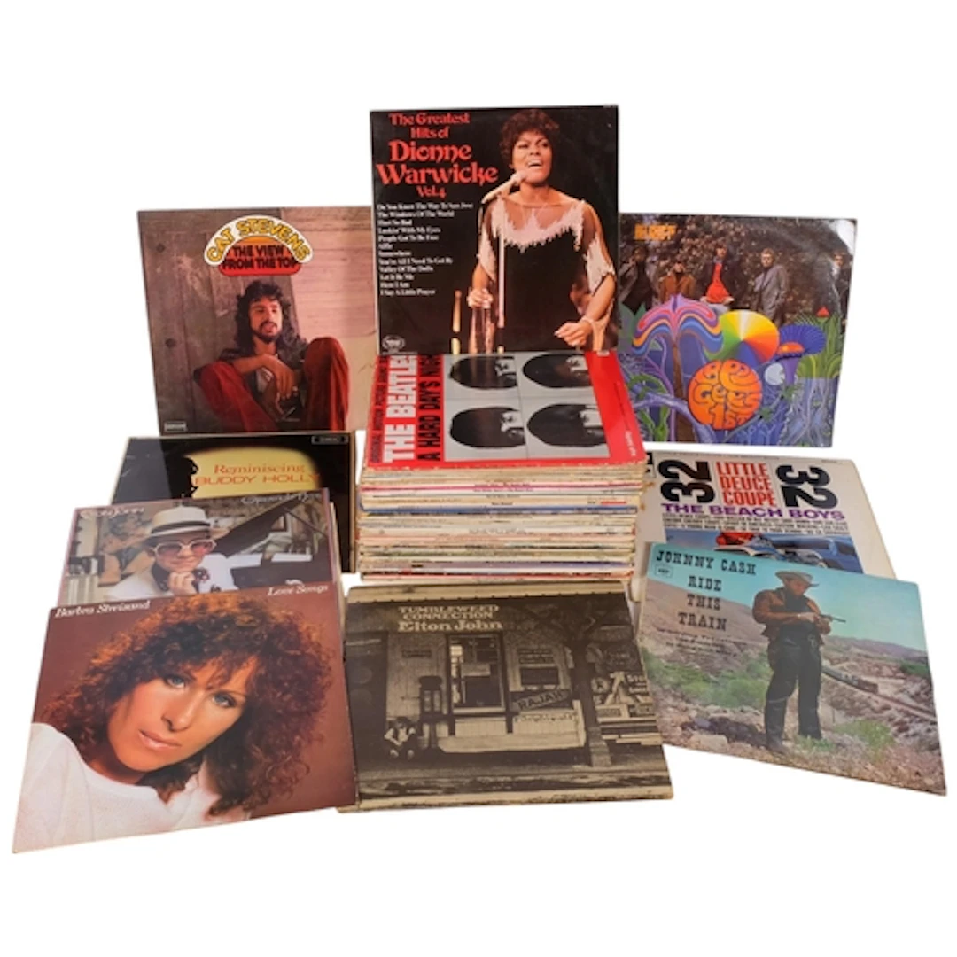 A collection of vinyl, artists including the Beatles, The Be...