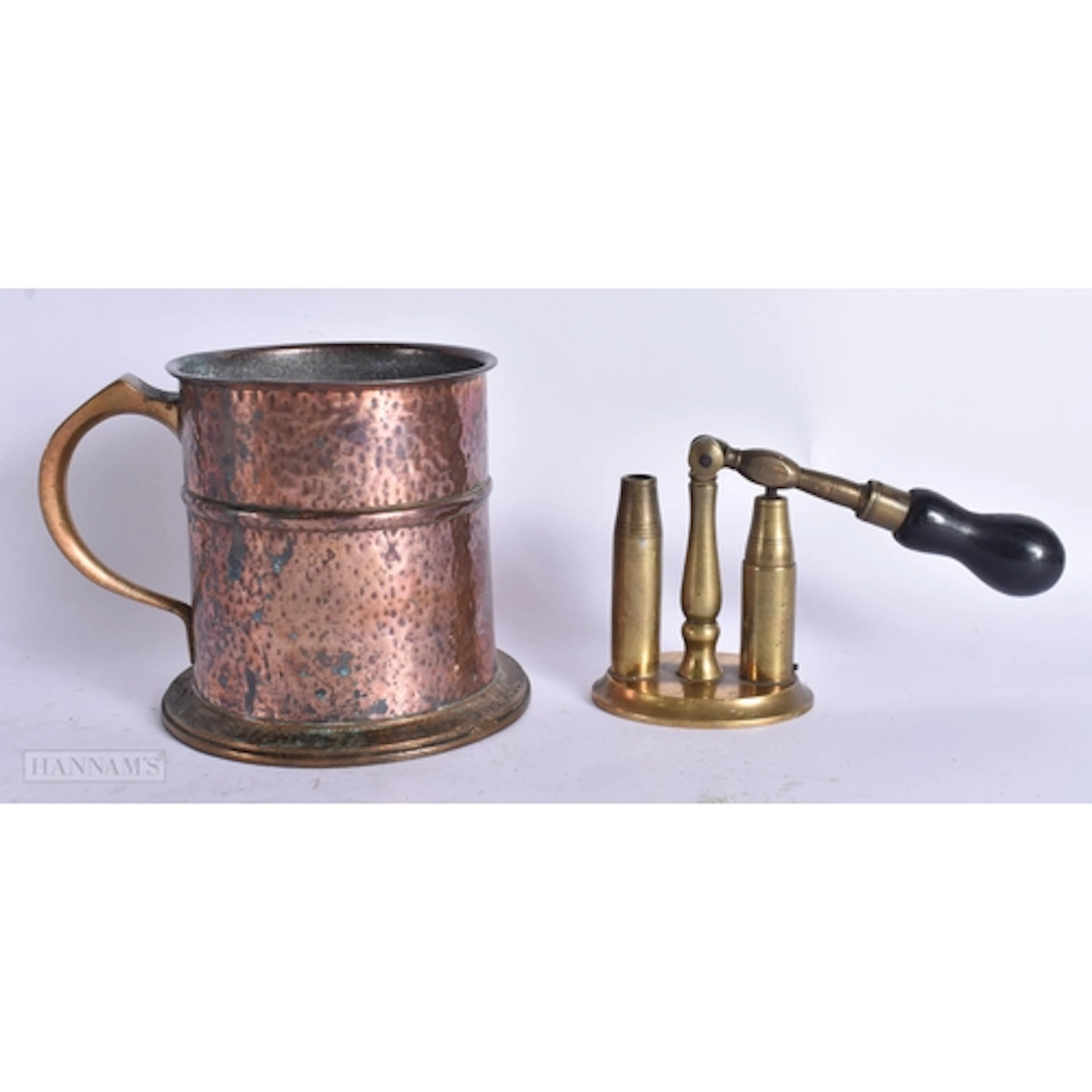 AN ART DECO HAMMERED COPPER AND BRONZE TANKARD together with...