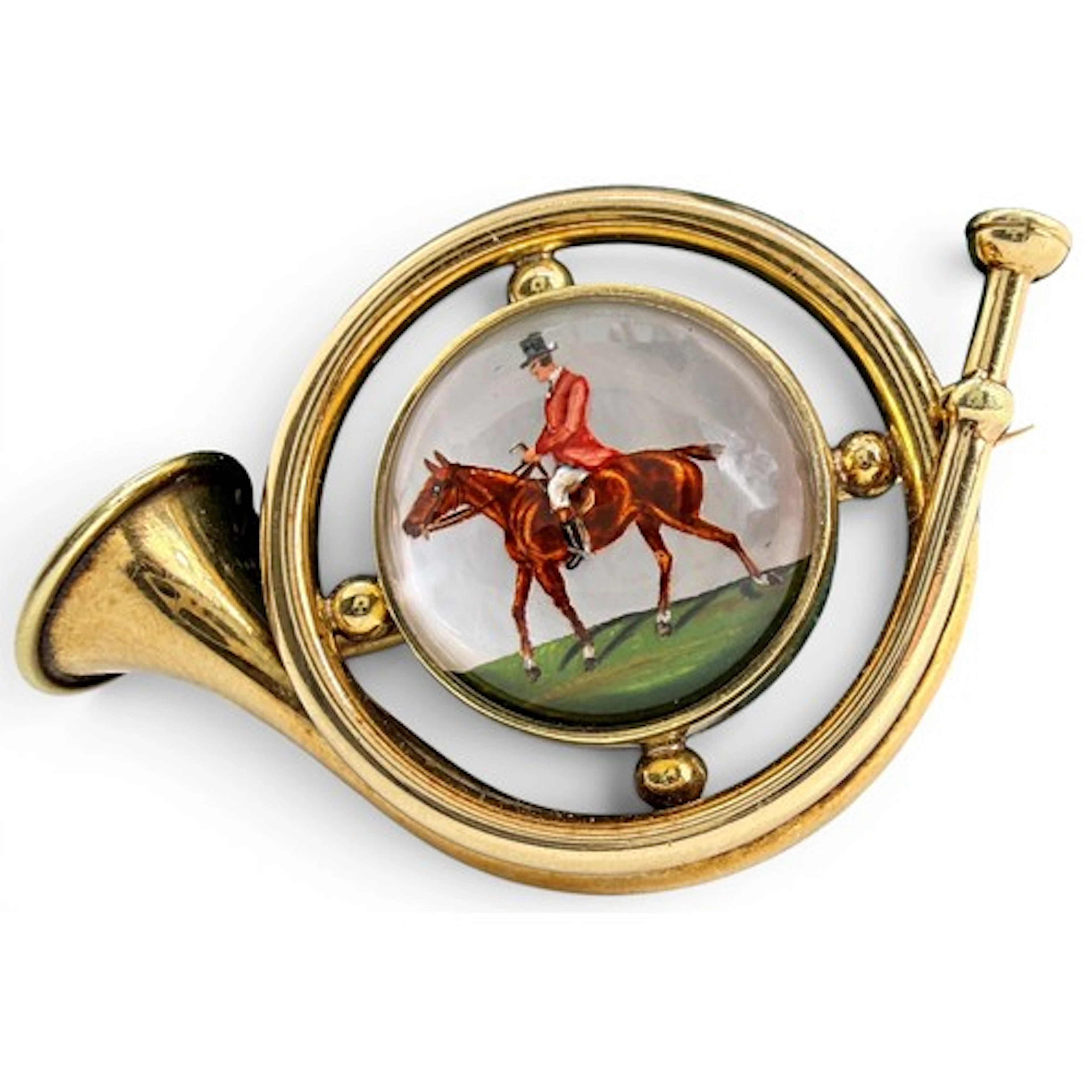 Marcus & Co. An American gold brooch in the form of a French...