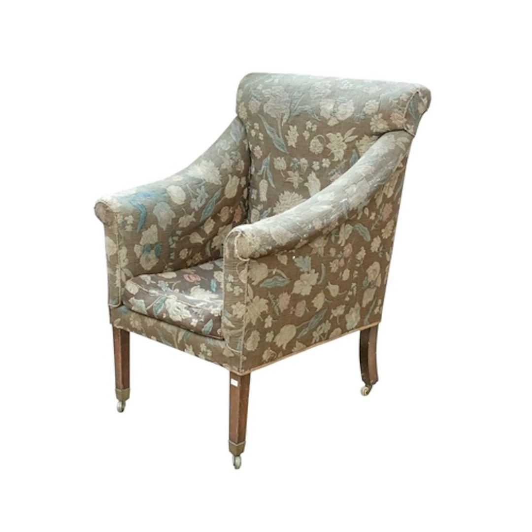An Edwardian mahogany framed armchair. With floral tapestry ...