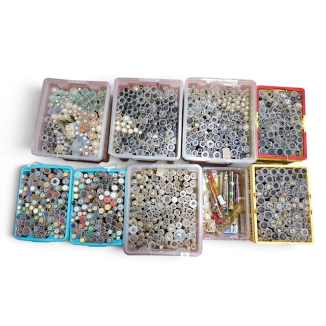 A large collection of buttons to include flat and shank exam...
