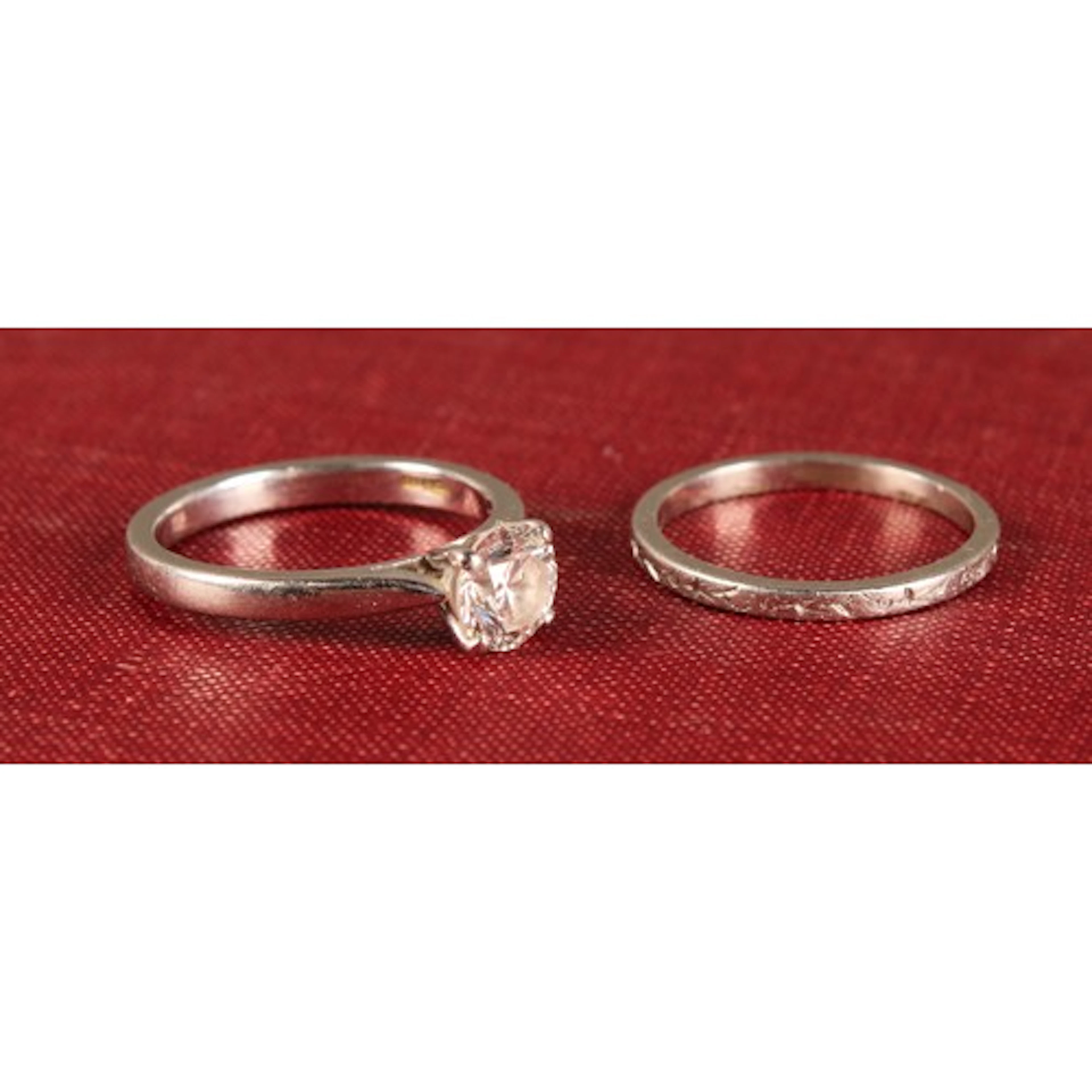 A platinum diamond solitaire ring, the central claw set bril...