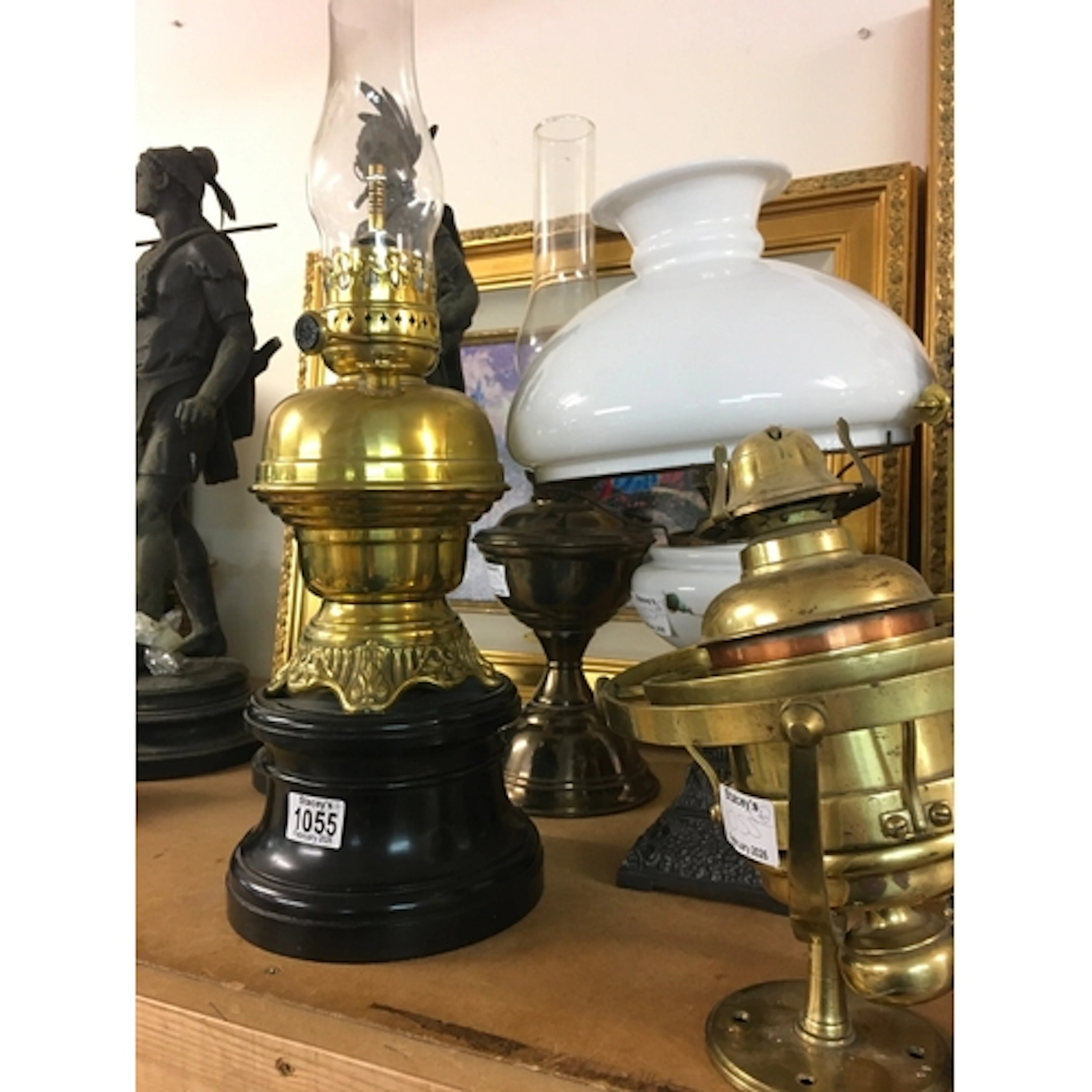 Four Oil lamps including a brass nautical style lamp , white...