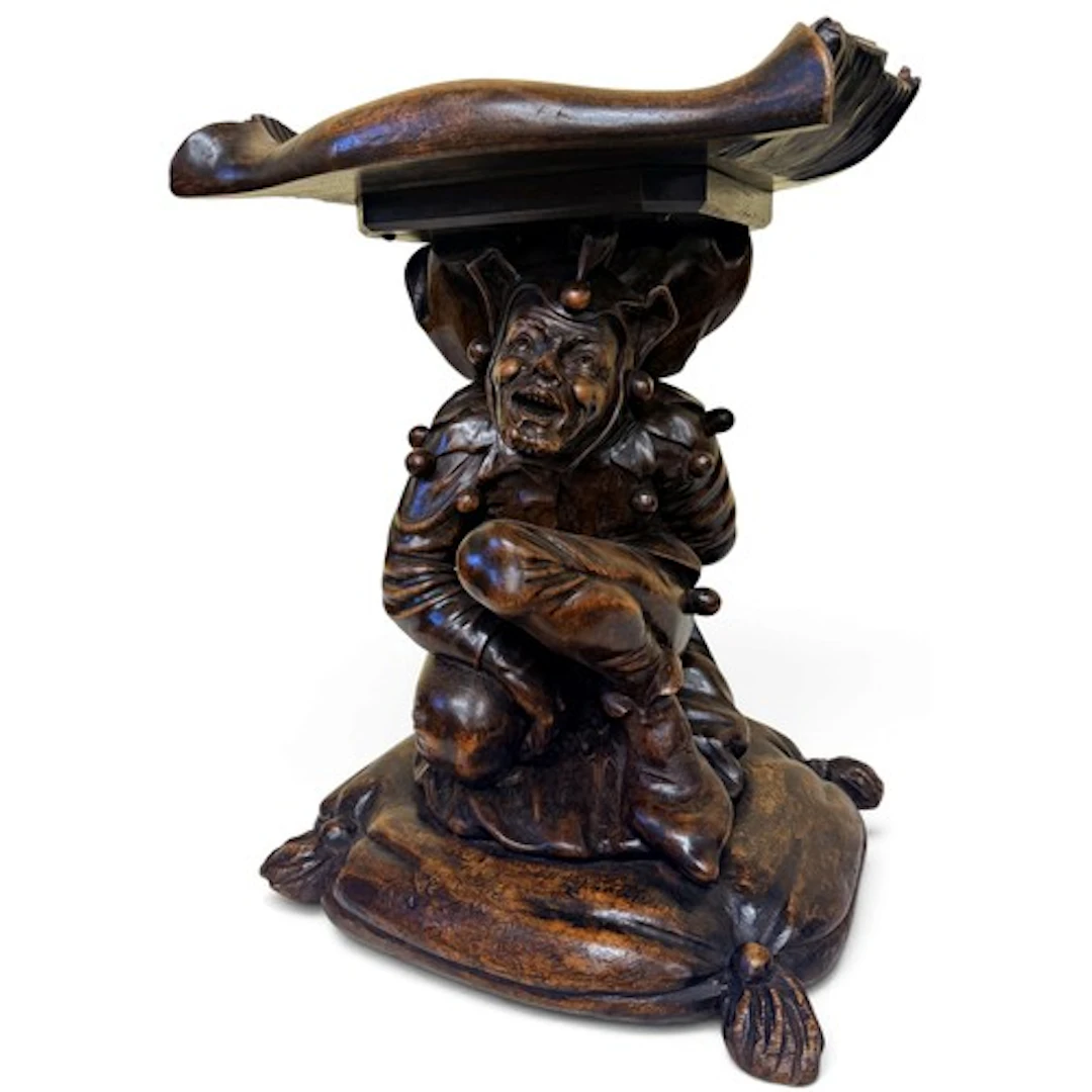A carved walnut figural Grotto chair, in the manner of Franc...