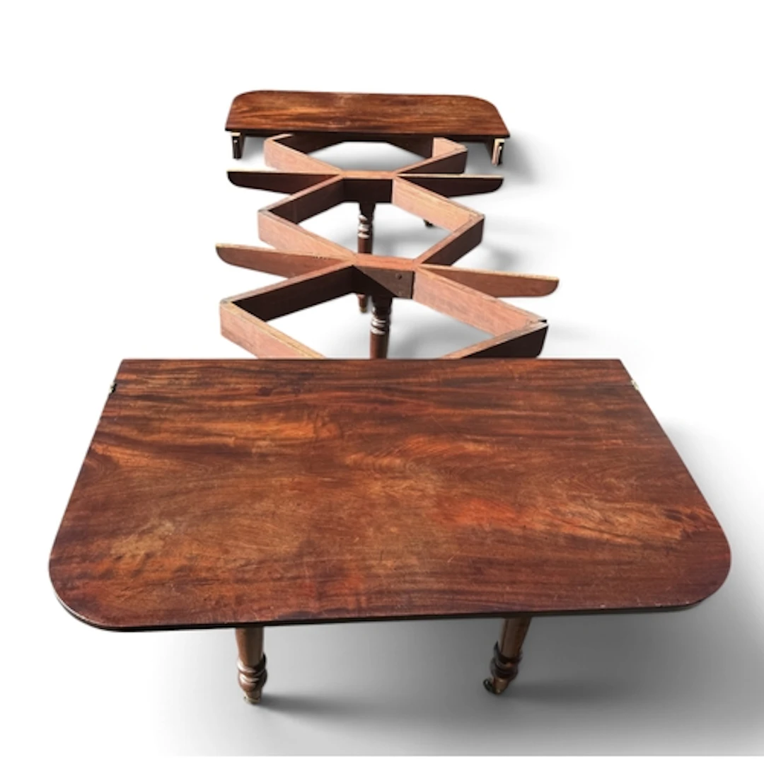 A FINE REGENCY CONCERTINA DINING TABLE IN CUBAN MAHOGANY CIR...