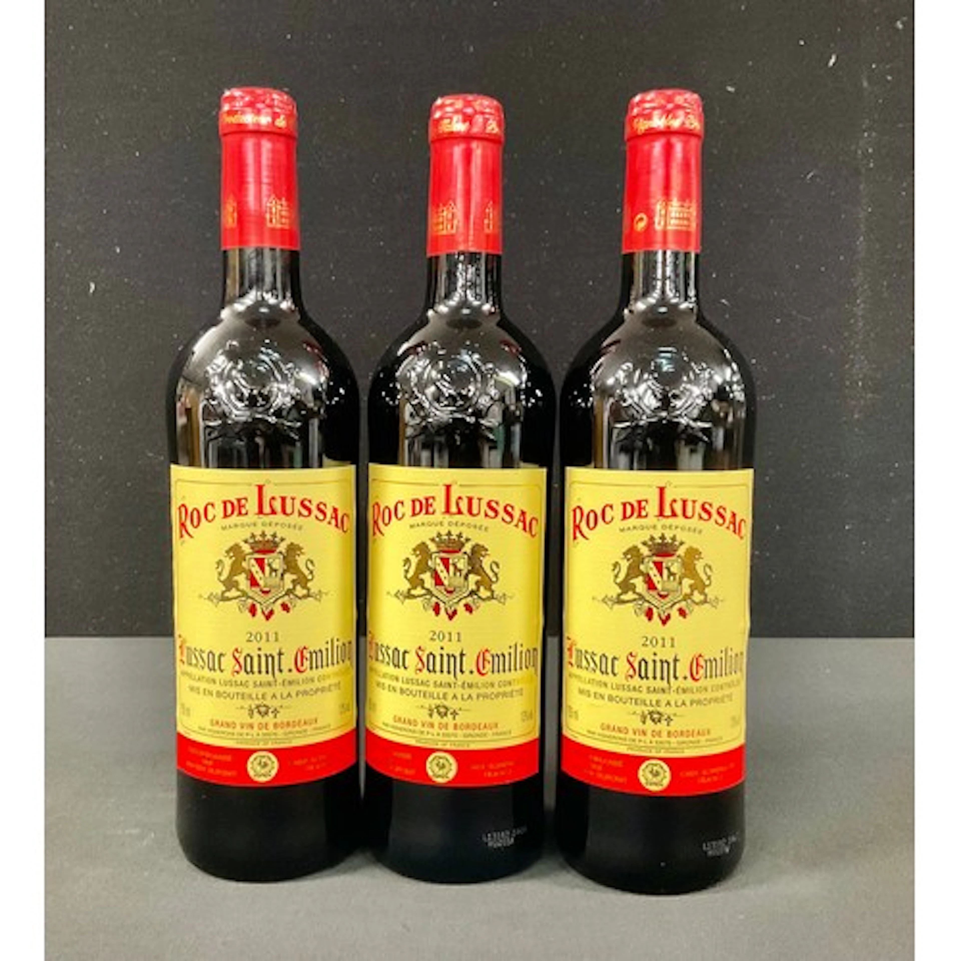 Wines & Spirits - three bottles of Roc de Lussac Saint Emili...