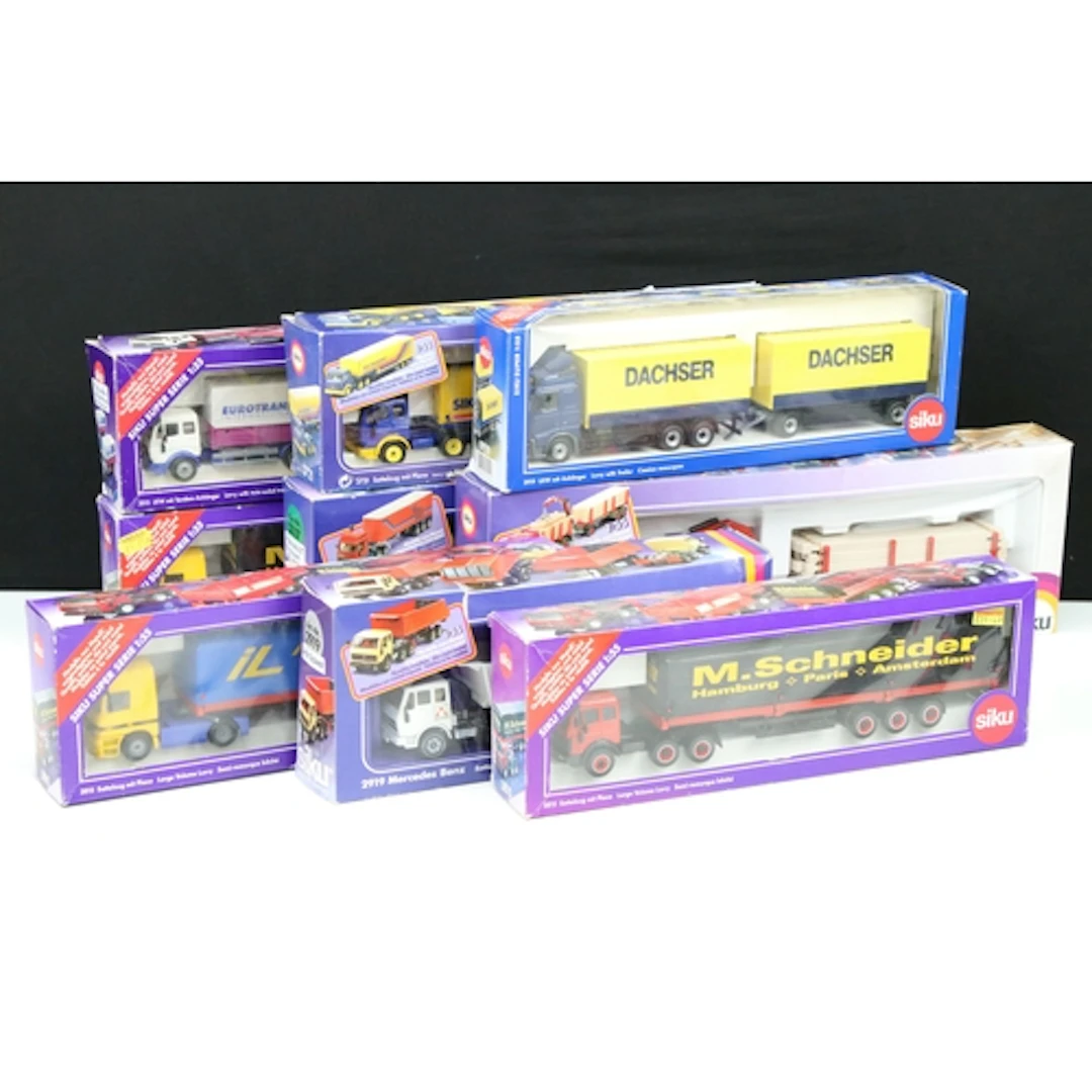 Nine boxed Siku haulage and commercial related diecast model...