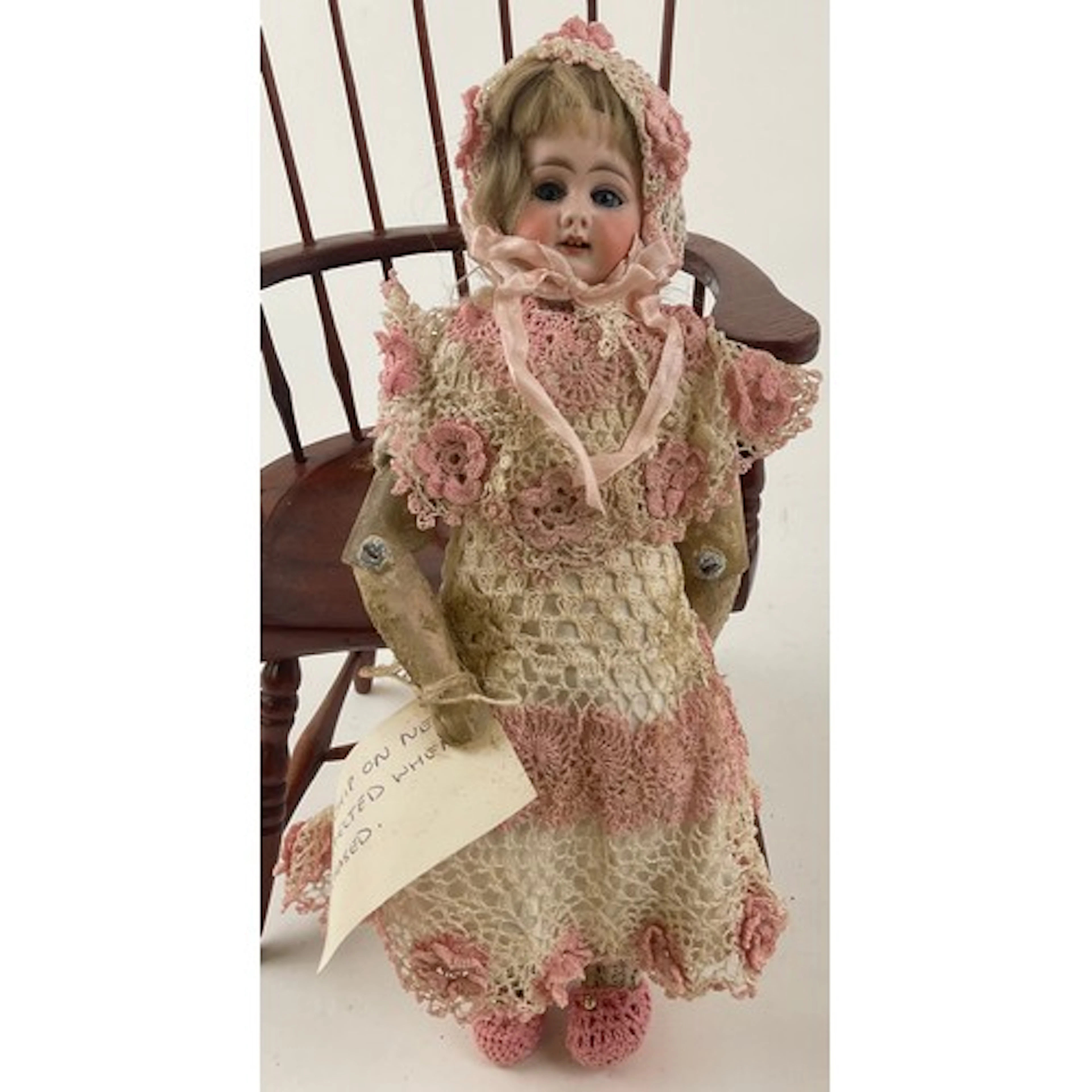 A late 19th century bisque swivel head child doll, probably ...