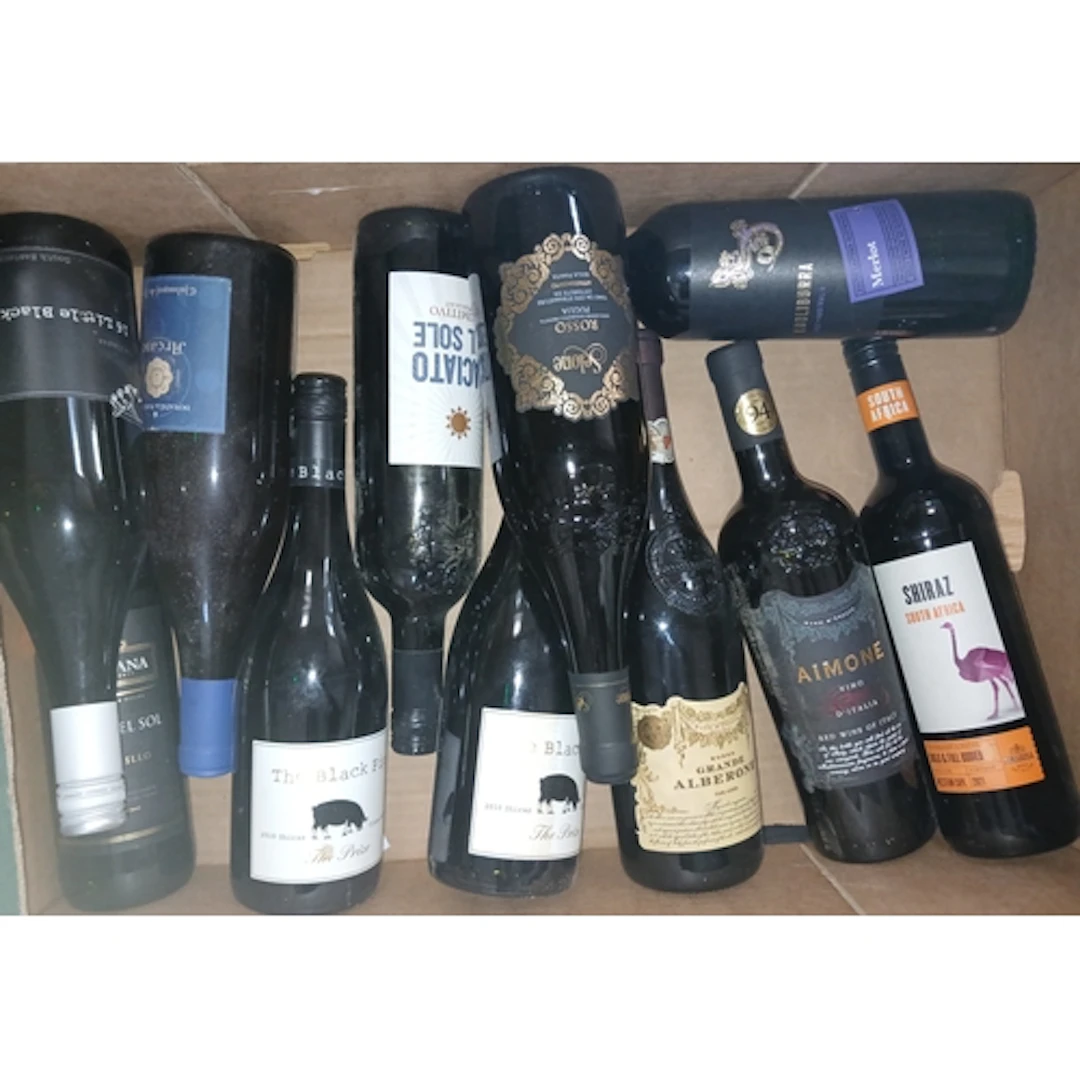 Four boxes of assorted red wines.