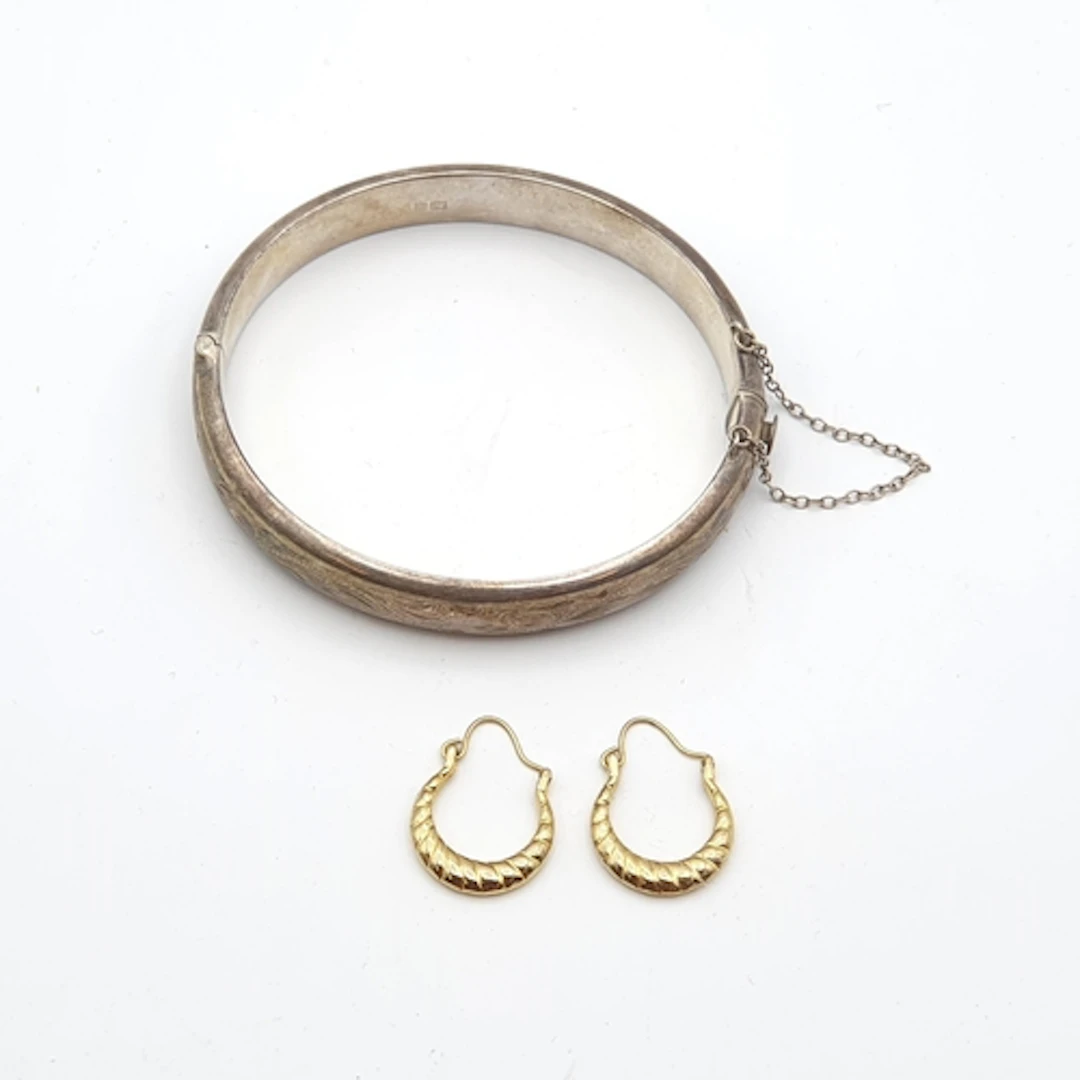 A vintage engraved Silver Bangle with safety chain, Birmingh...