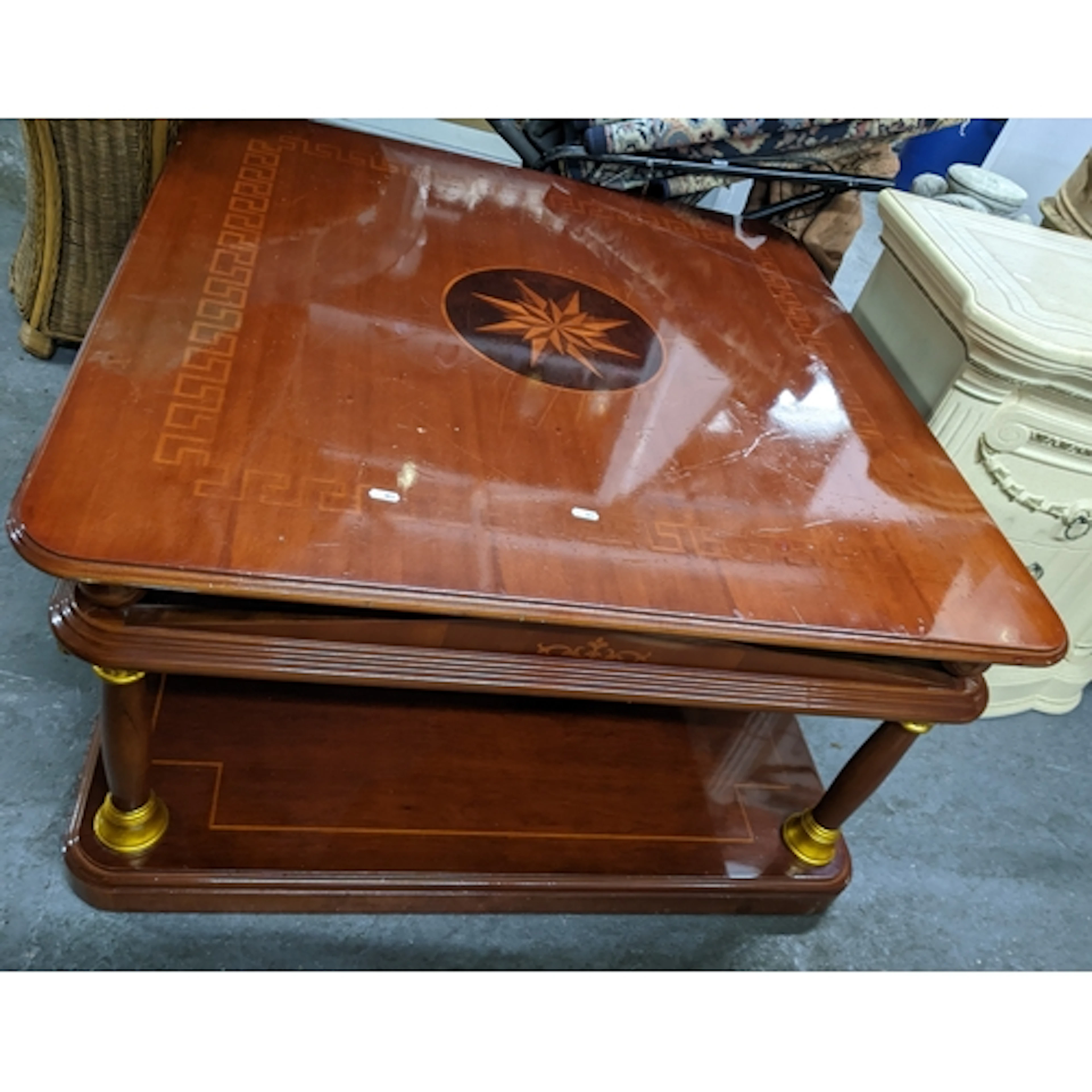 An Italian inlaid teak and gilded two tier coffee table and ...
