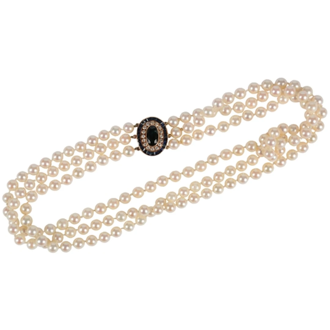 A cultured pearl, sapphire and diamond necklace, designed as...