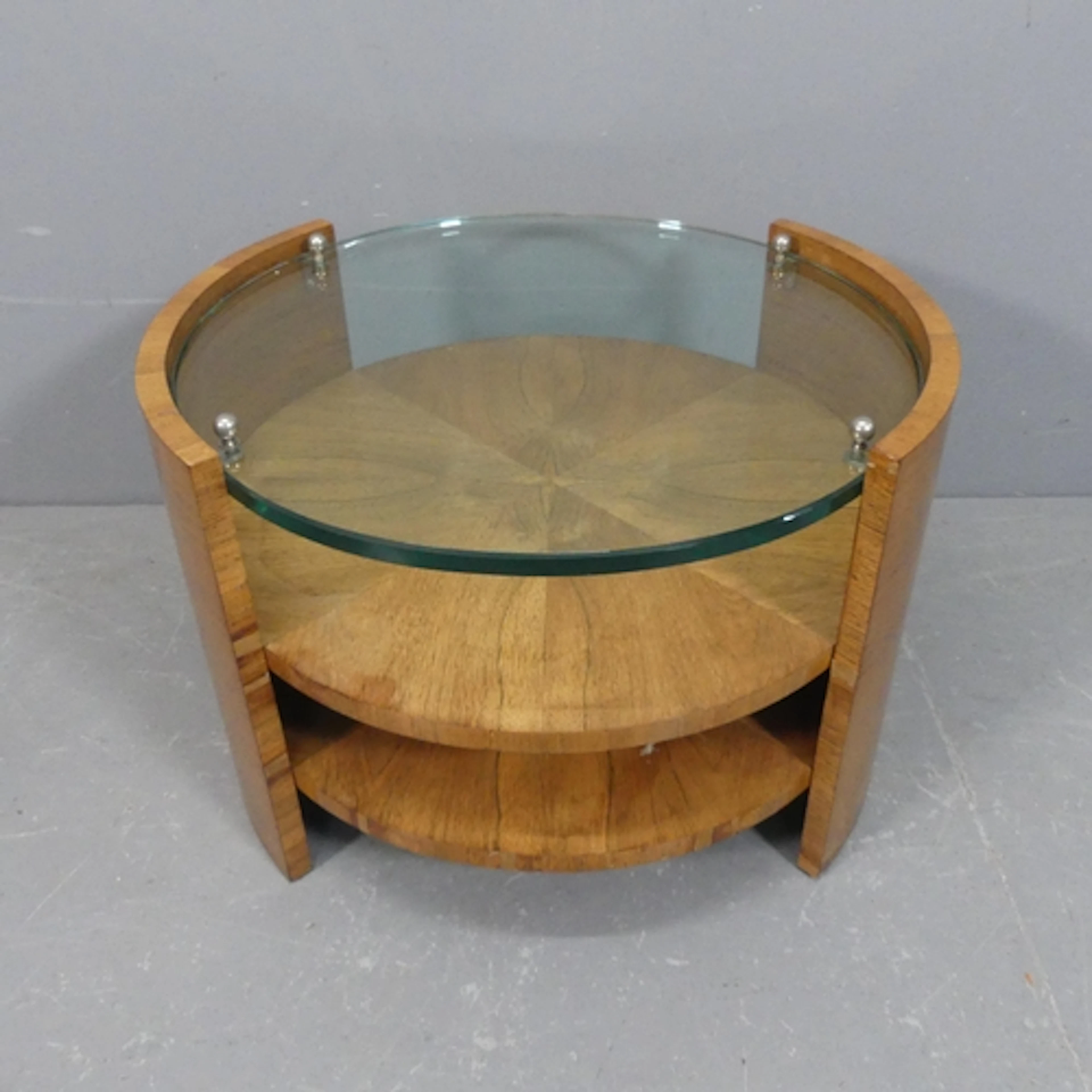 Attributed to Jacques Adnet - An Art Deco two-tier walnut an...