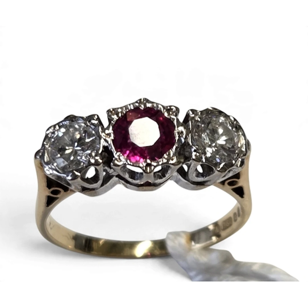 A superb 18-carat gold ruby and diamond ring, centrally set ...