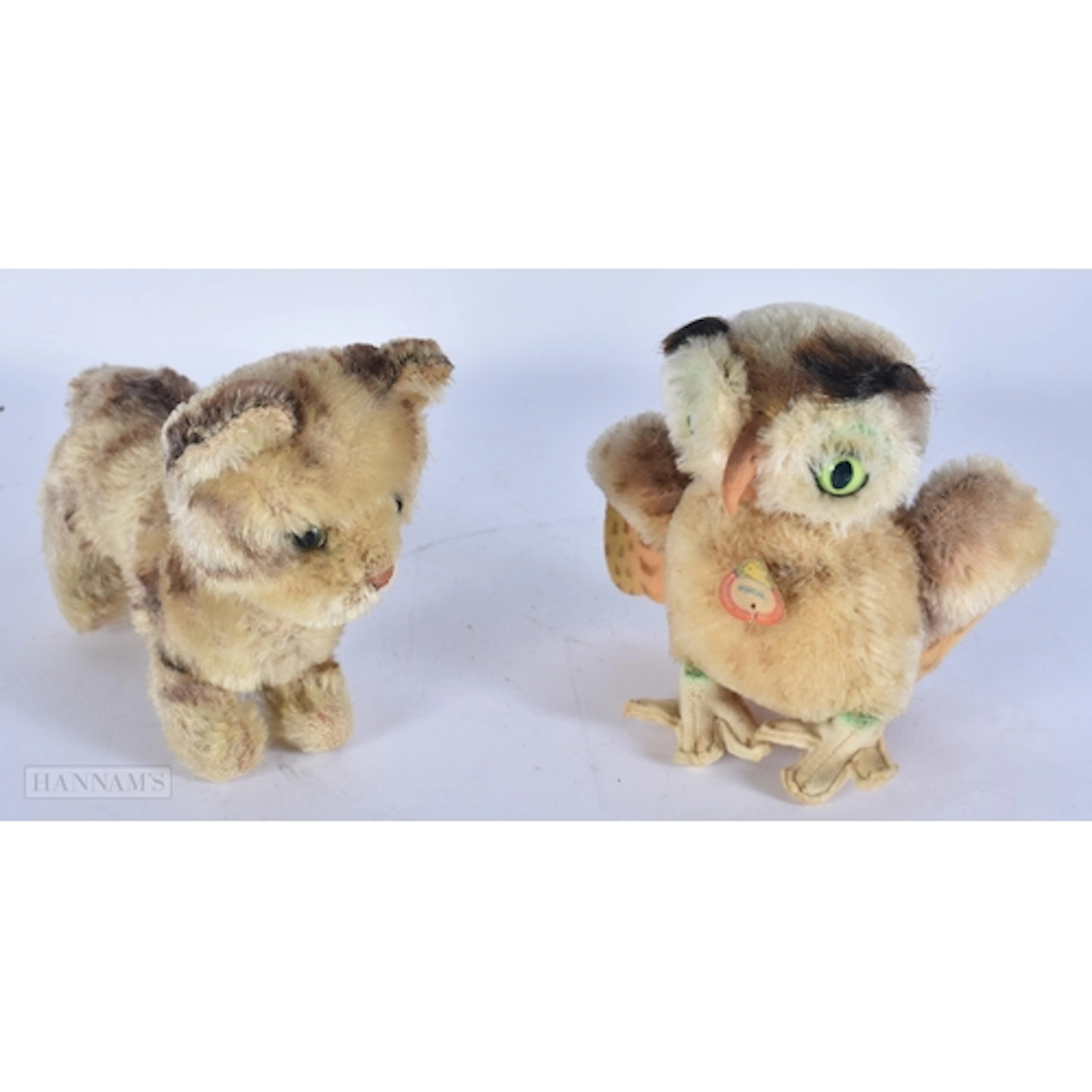 A STEIFF CAT and a Steiff owl. (2)