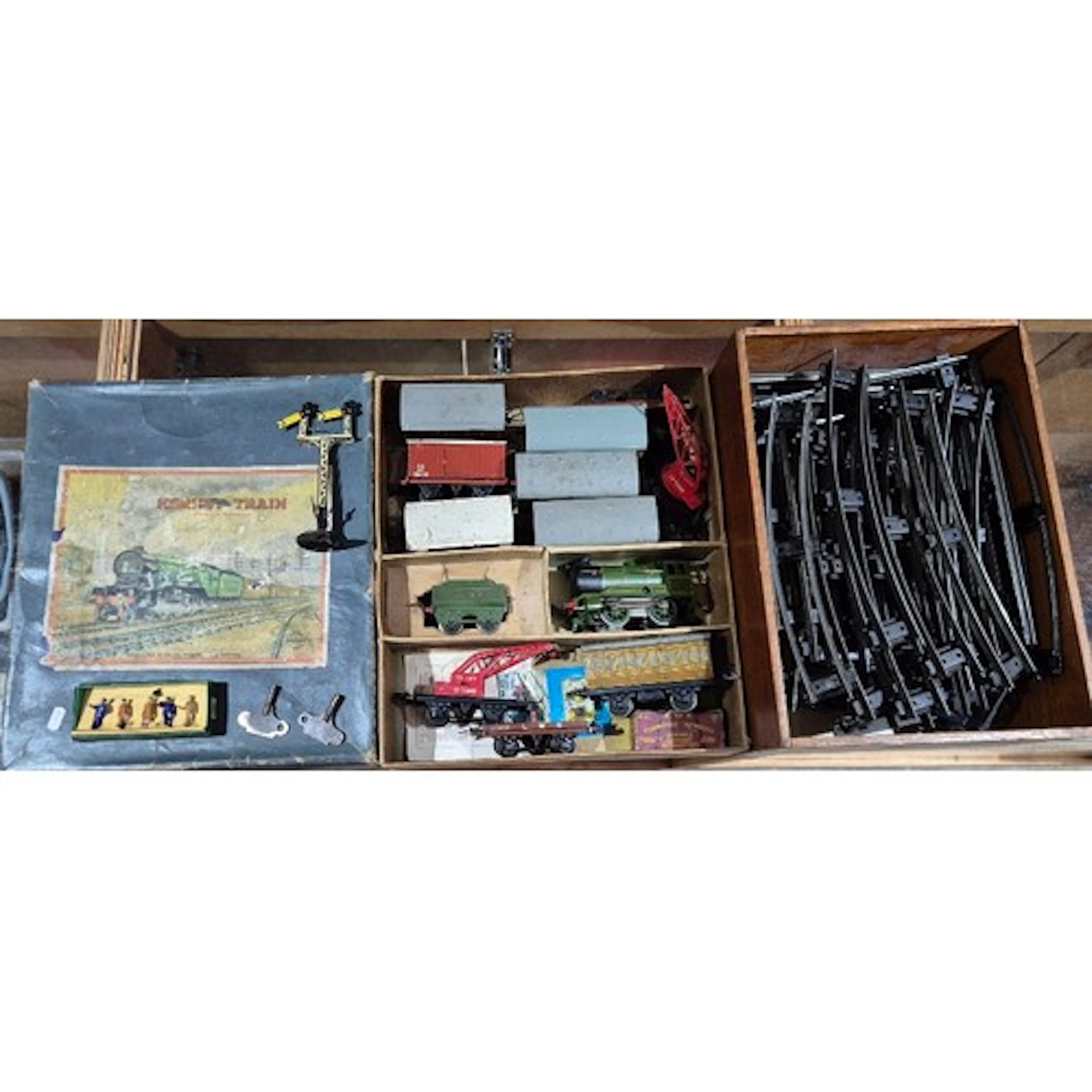 A Hornby clockwork tin train set with engine, coaches, crane...