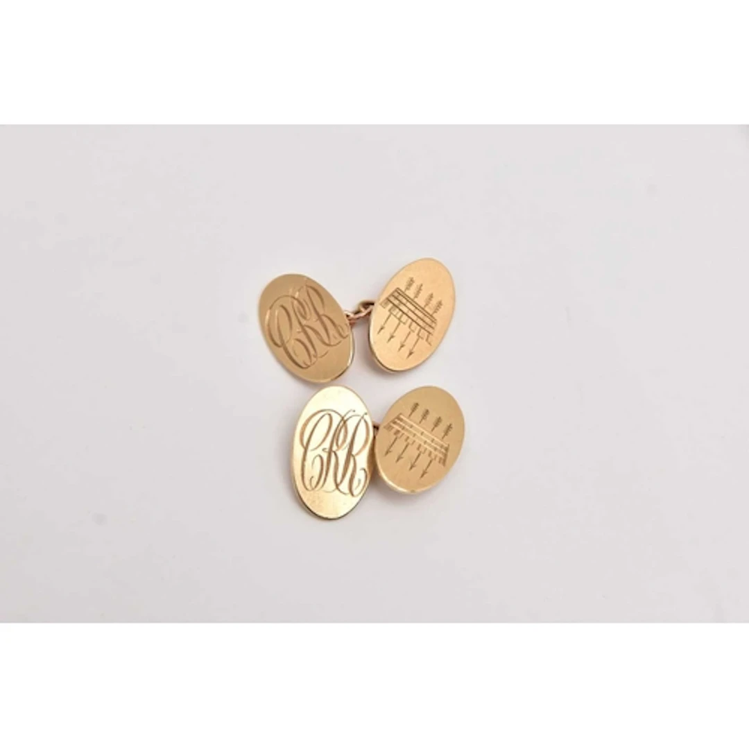 A PAIR OF YELLOW GOLD CUFFLINKS, oval form with monogram eng...