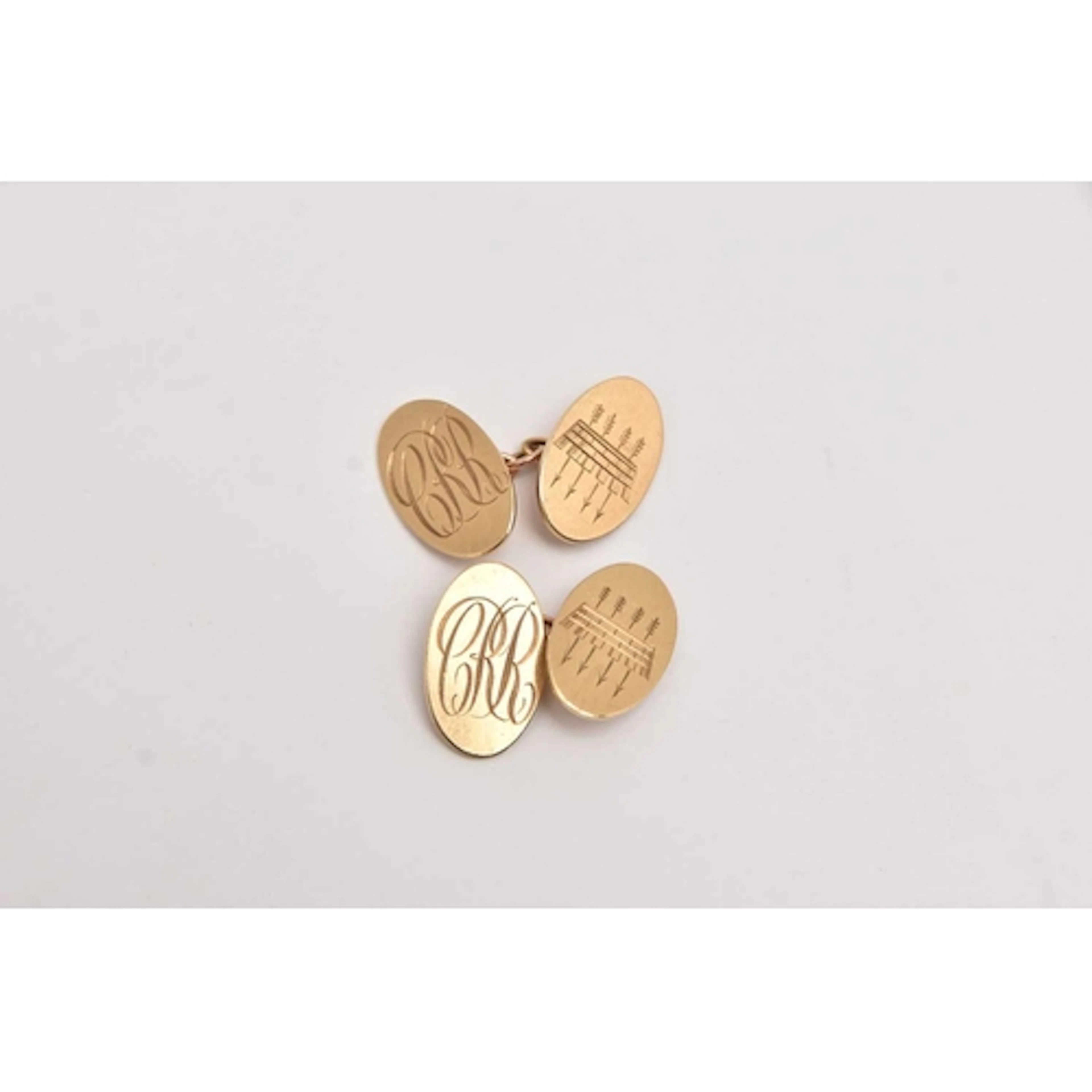 A PAIR OF YELLOW GOLD CUFFLINKS, oval form with monogram eng...