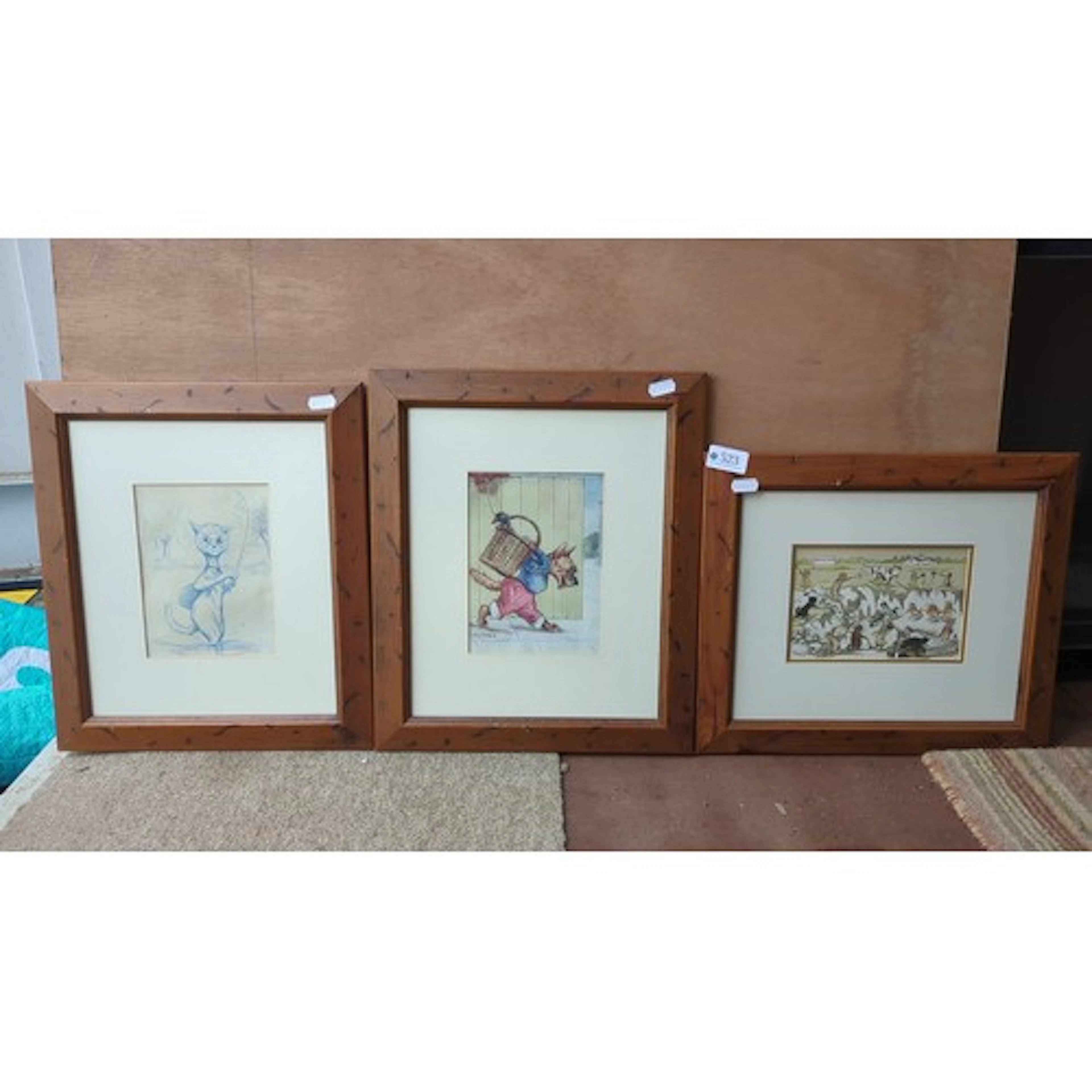 A group of three Louis Wain printed illustrations on paper, ...