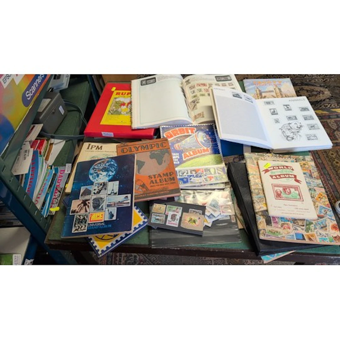 A collection of world postage stamps, predominantly used, ho...