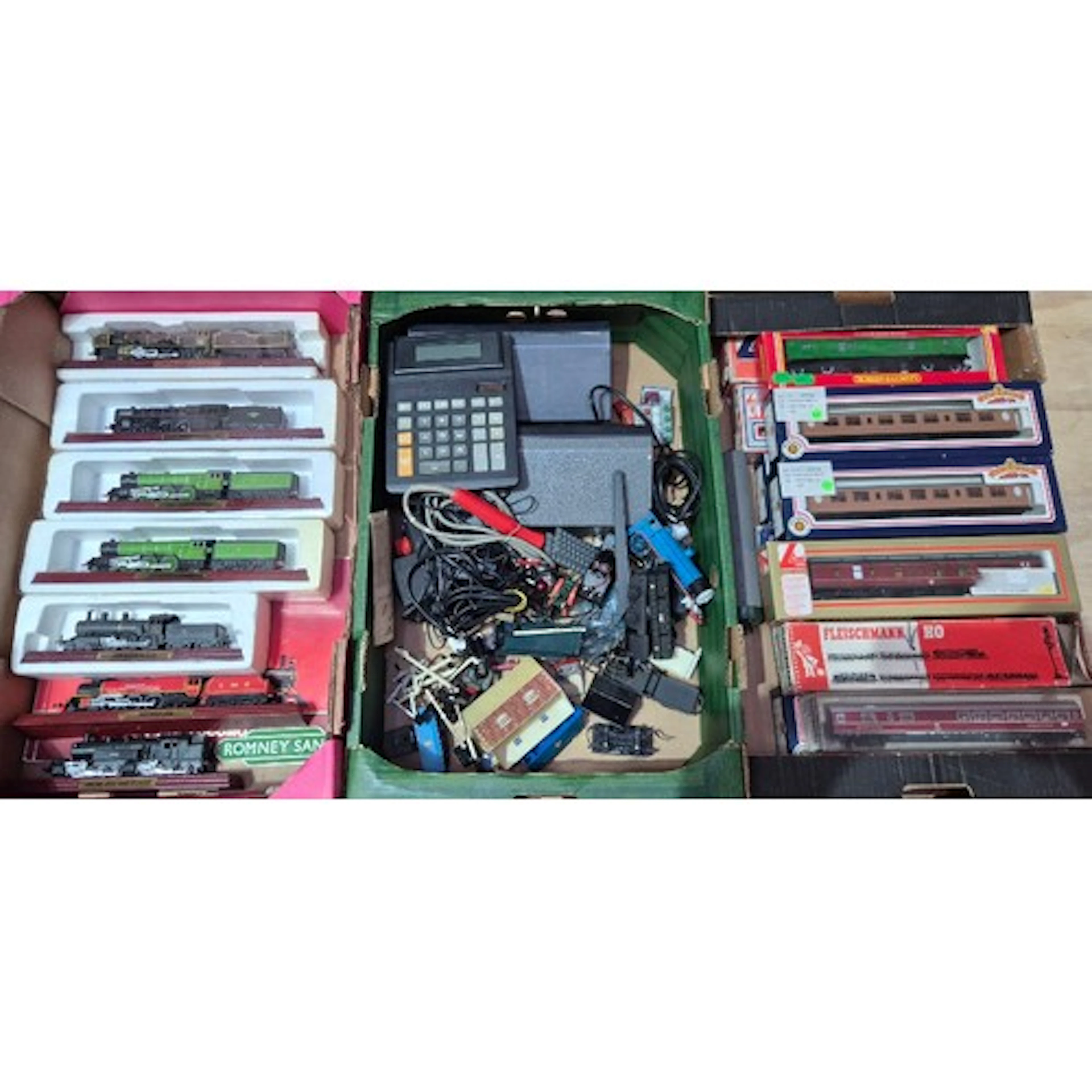 Three boxes of assorted model train items to include coaches...