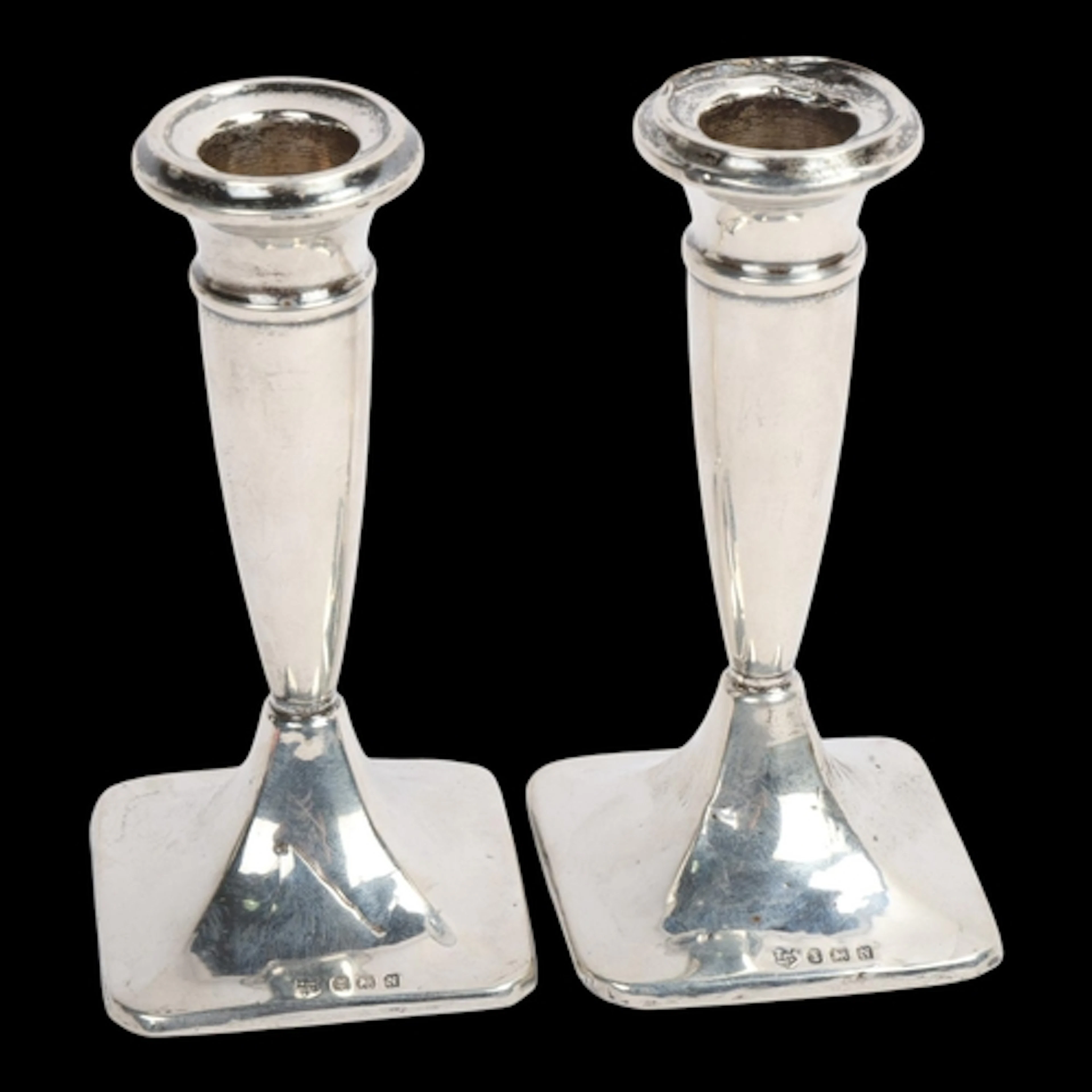 A pair of George VI silver table candlesticks, W J Myatt & C...