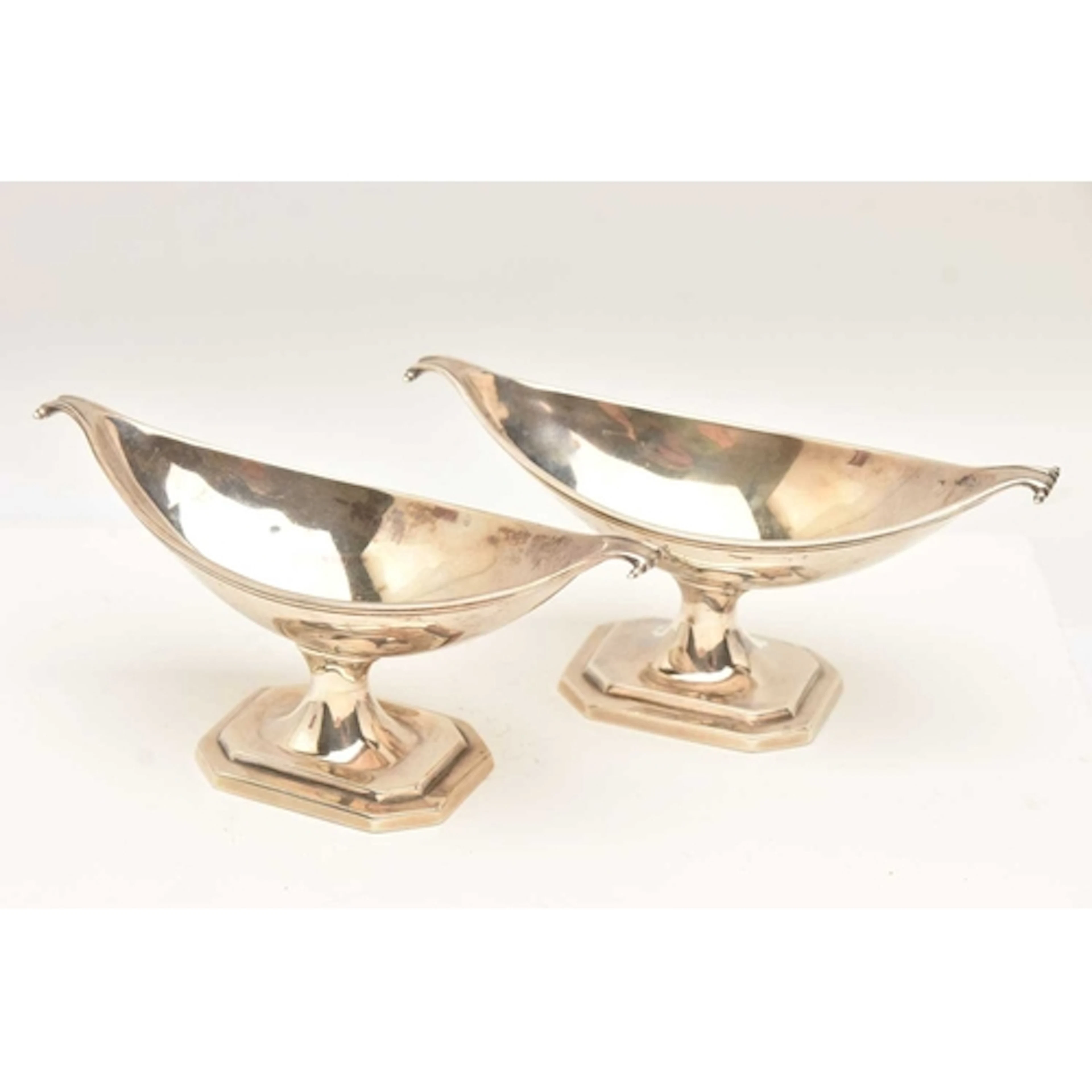 A PAIR OF LATE VICTORIAN SILVER SALTS, each of an oval pedis...