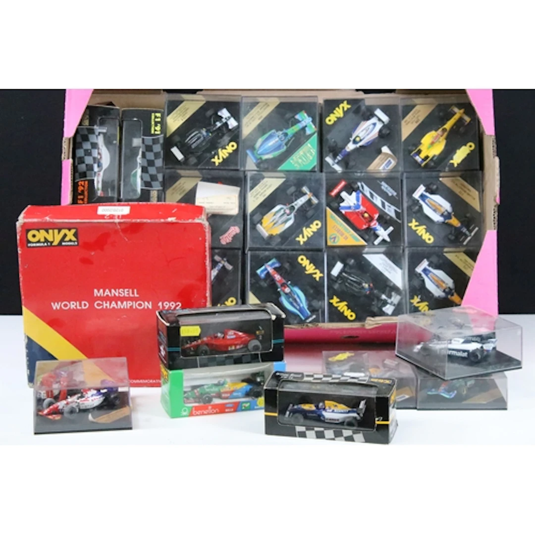40 Boxed / cased racing related diecast models to include On...