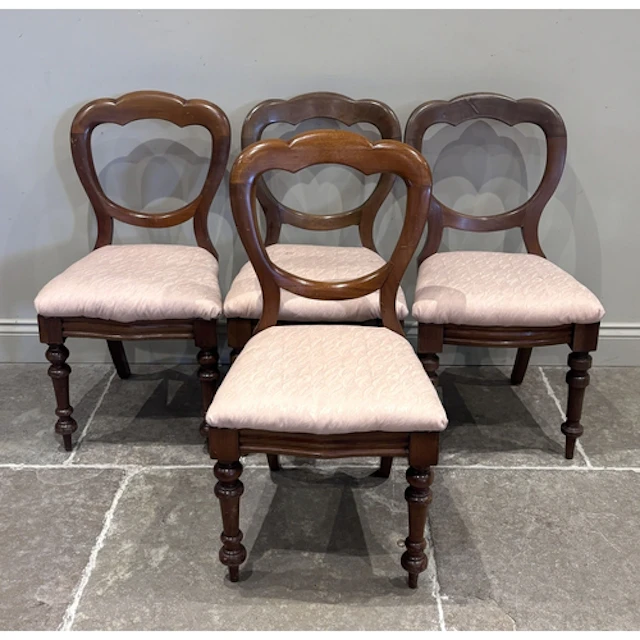 A set of four Victorian mahogany balloon back dining chairs,...