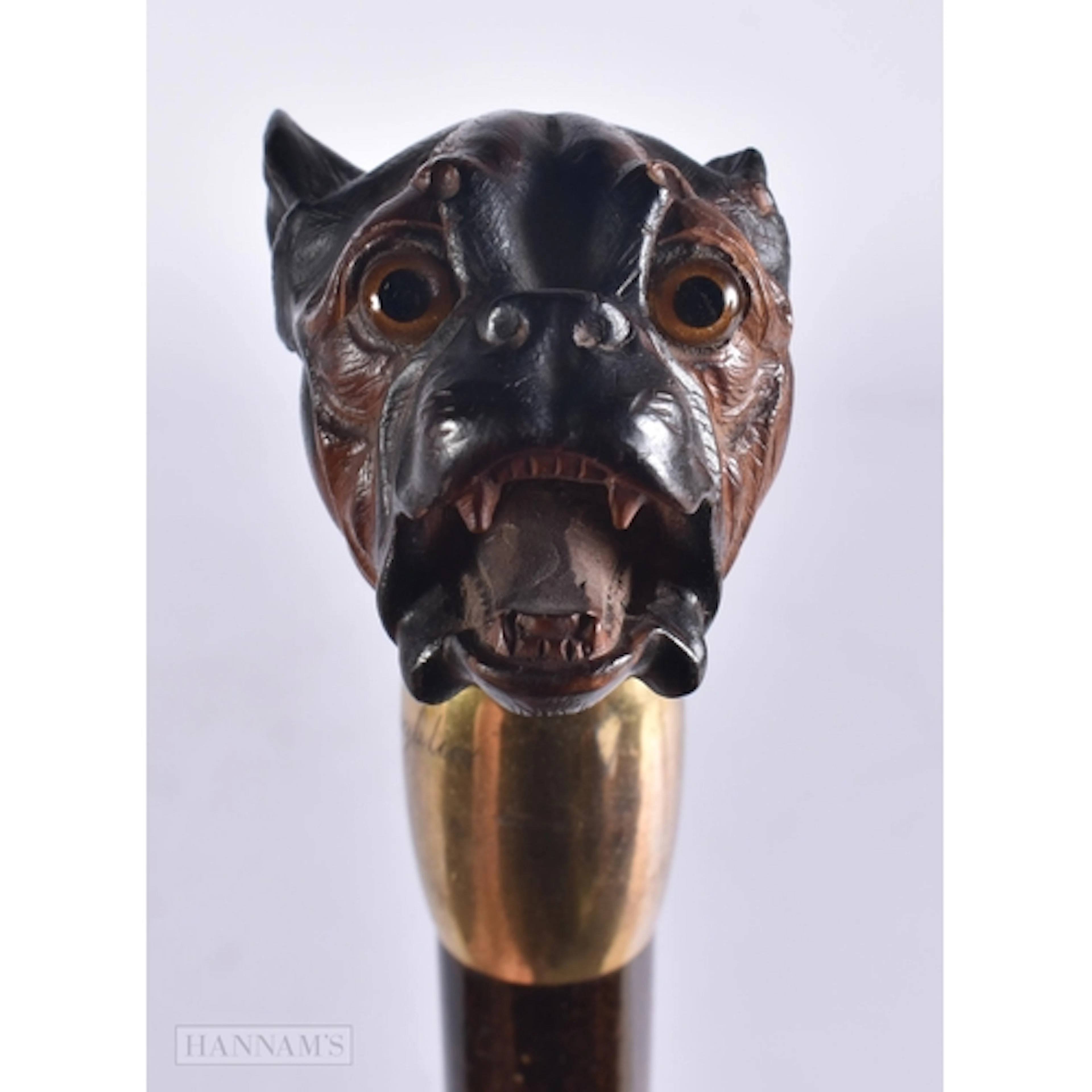 AN ANTIQUE BAVARIAN BLACK FOREST DOG HEAD PARASOL. 102 cm lo...
