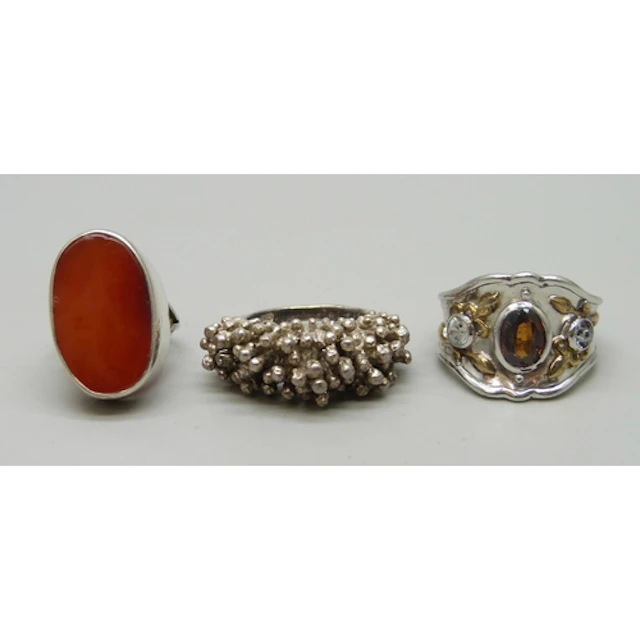 Three silver rings including a Brutalist example, and a carn...