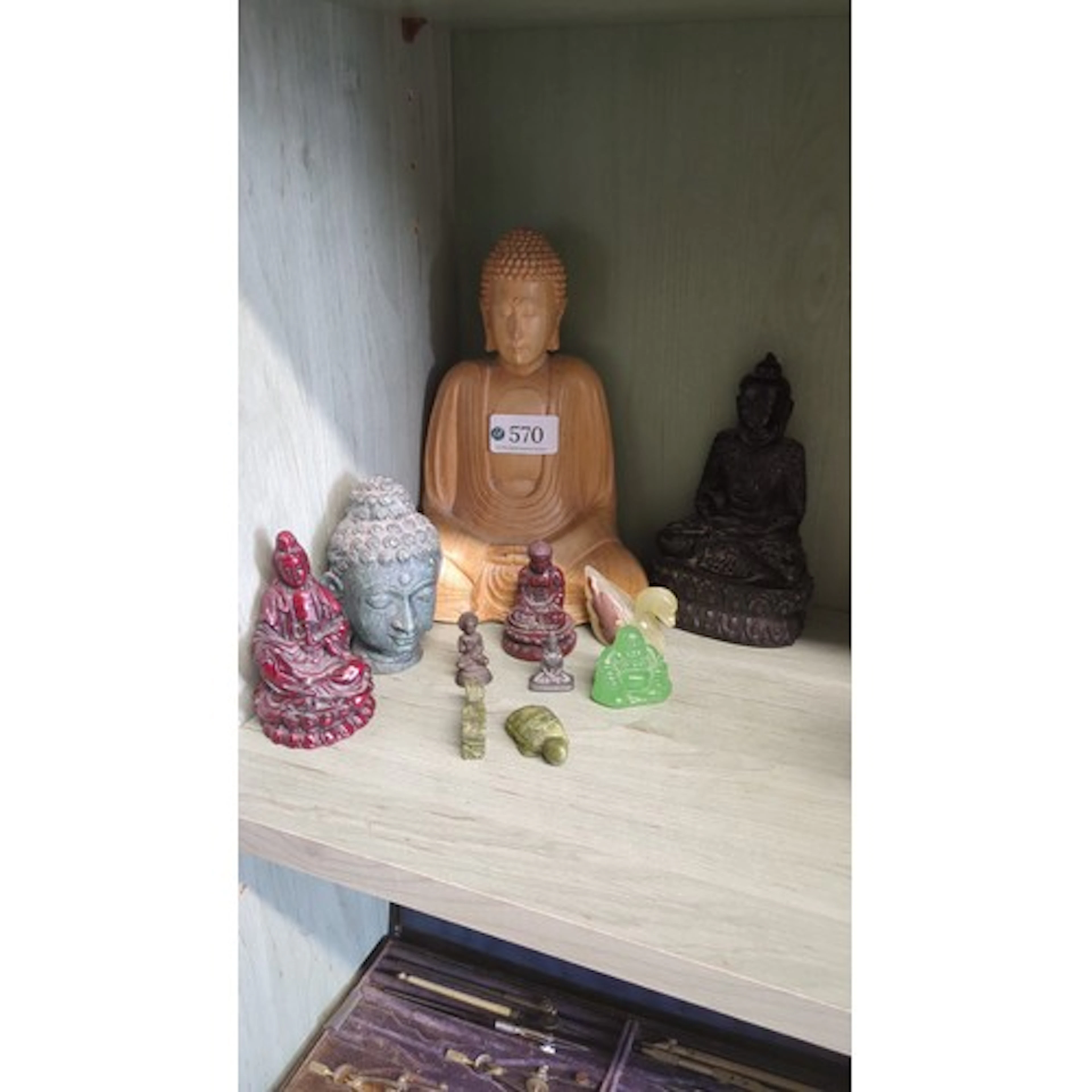 A collection of mainly Buddhist devotional figures and carvi...