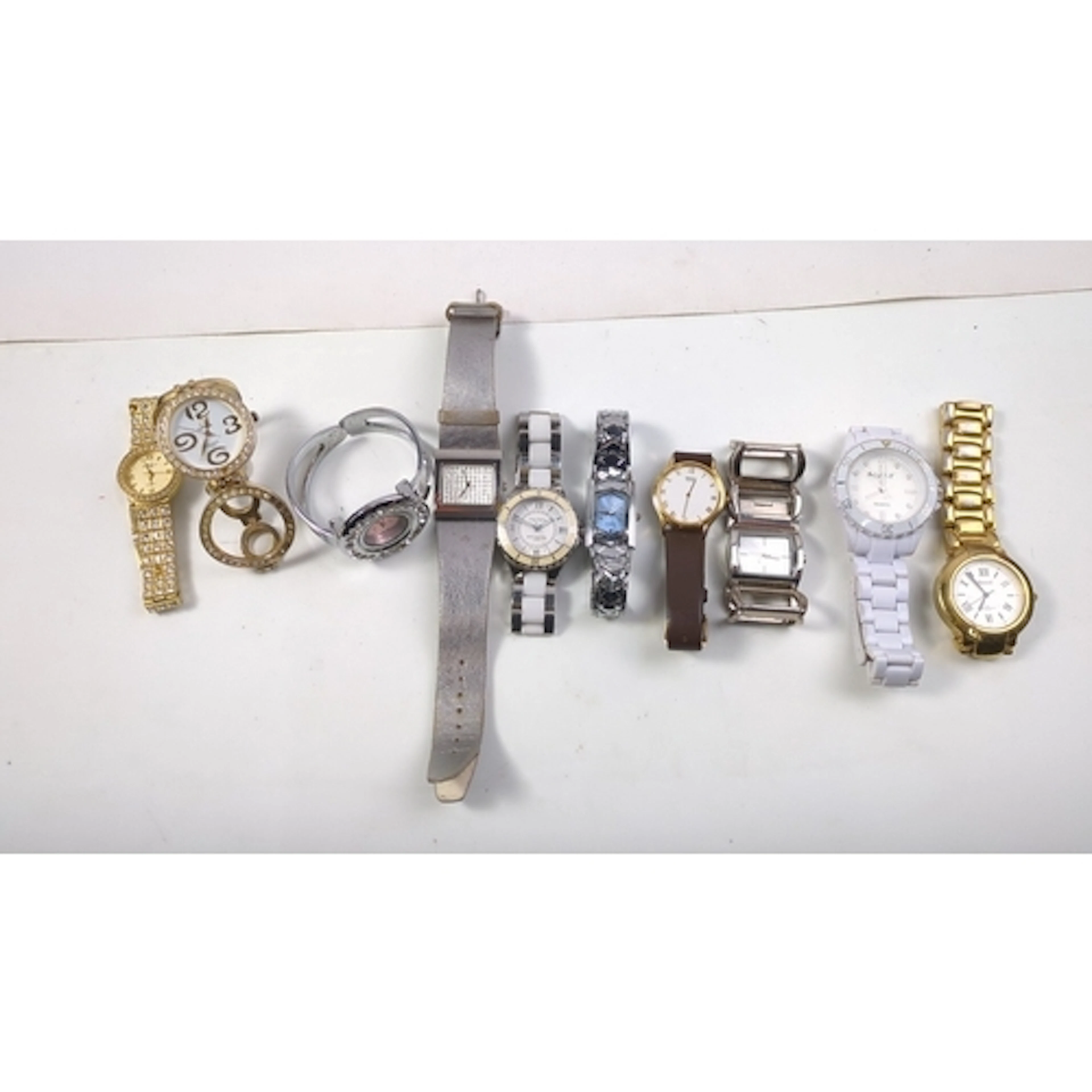 A group of assorted quartz wristwatches, including gold-tone...