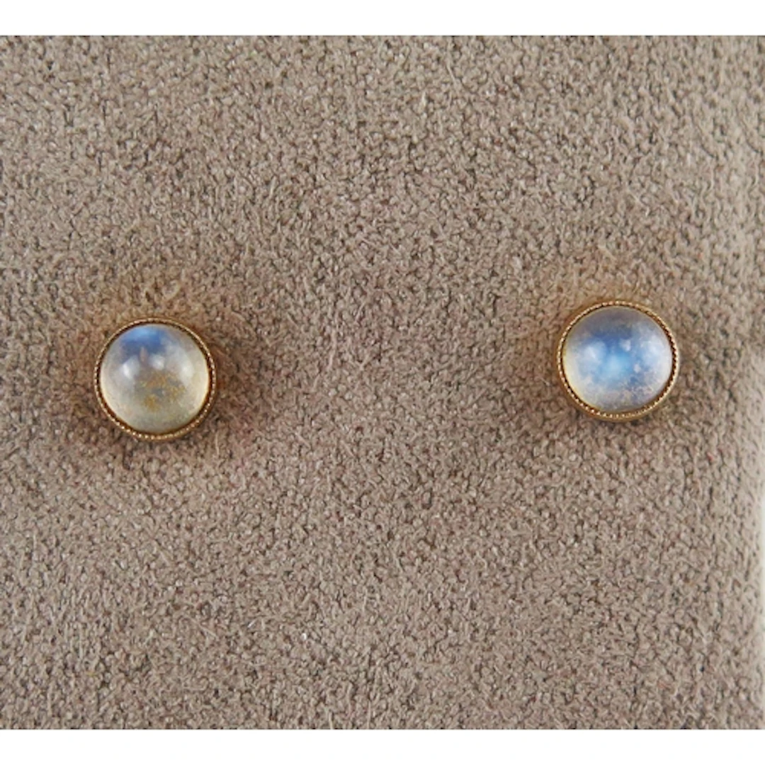 A pair of moonstone stud earrings in 9ct yellow gold mounts,...