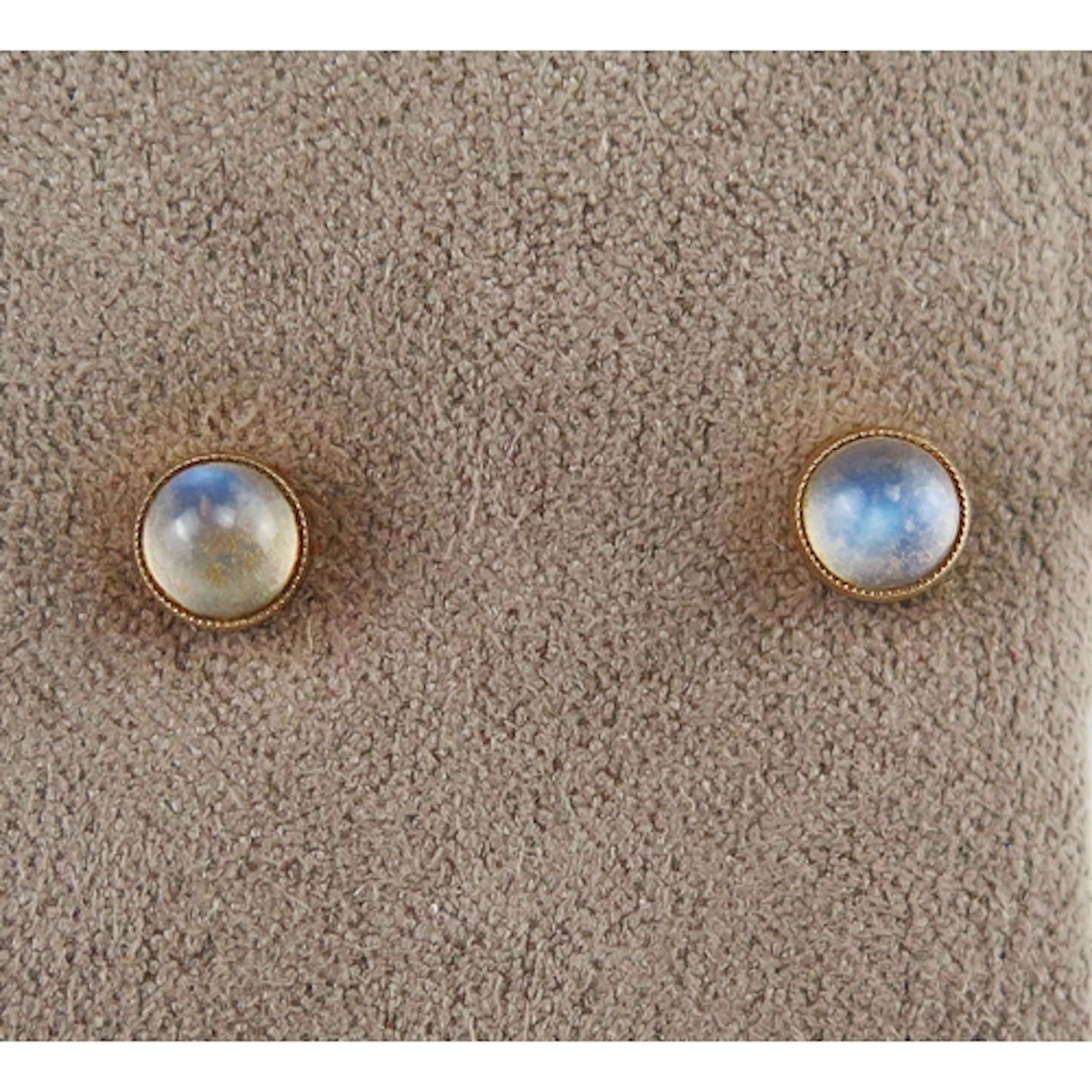 A pair of moonstone stud earrings in 9ct yellow gold mounts,...