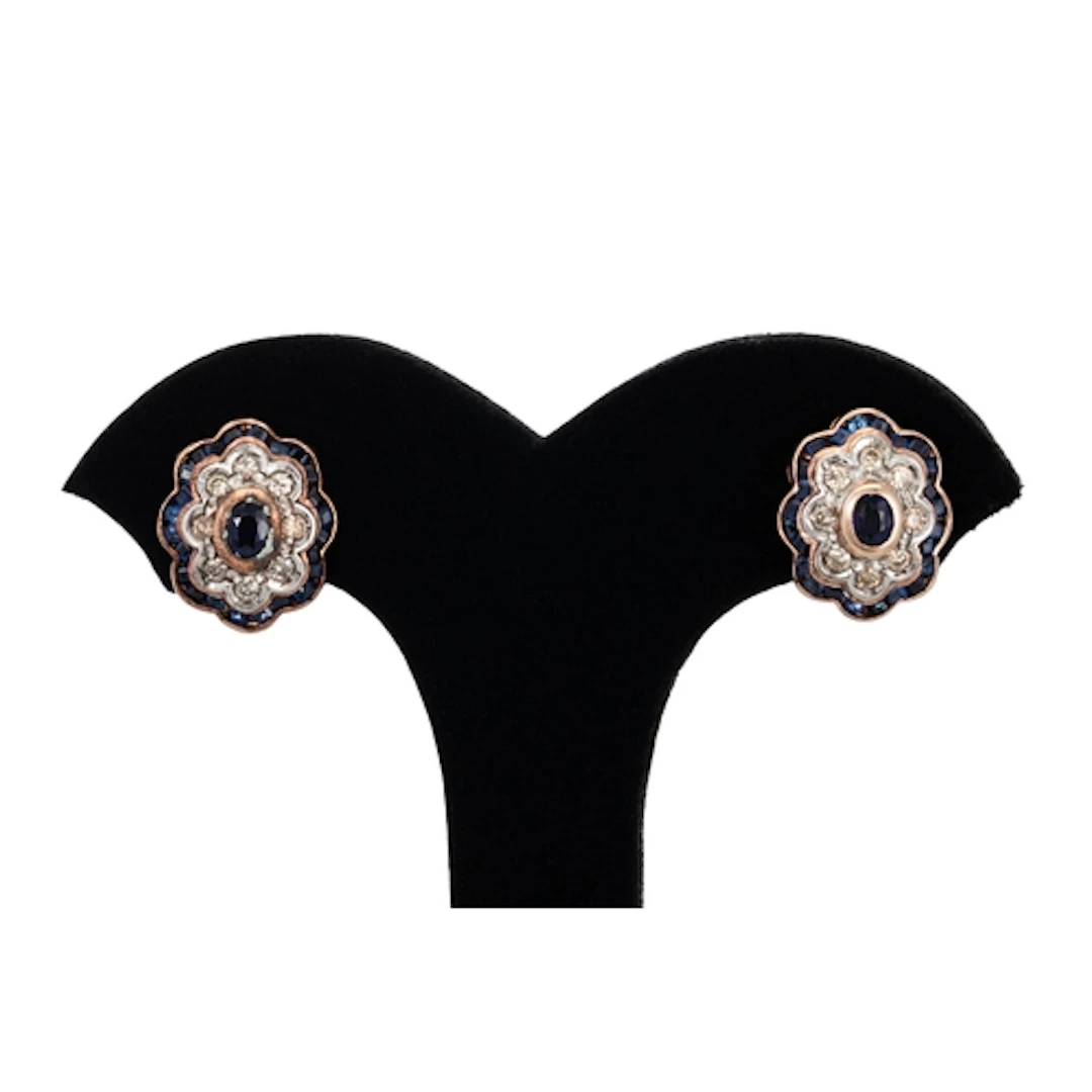 A PAIR OF SAPPHIRE AND DIAMOND CLUSTER EARRINGS, of wavy out...