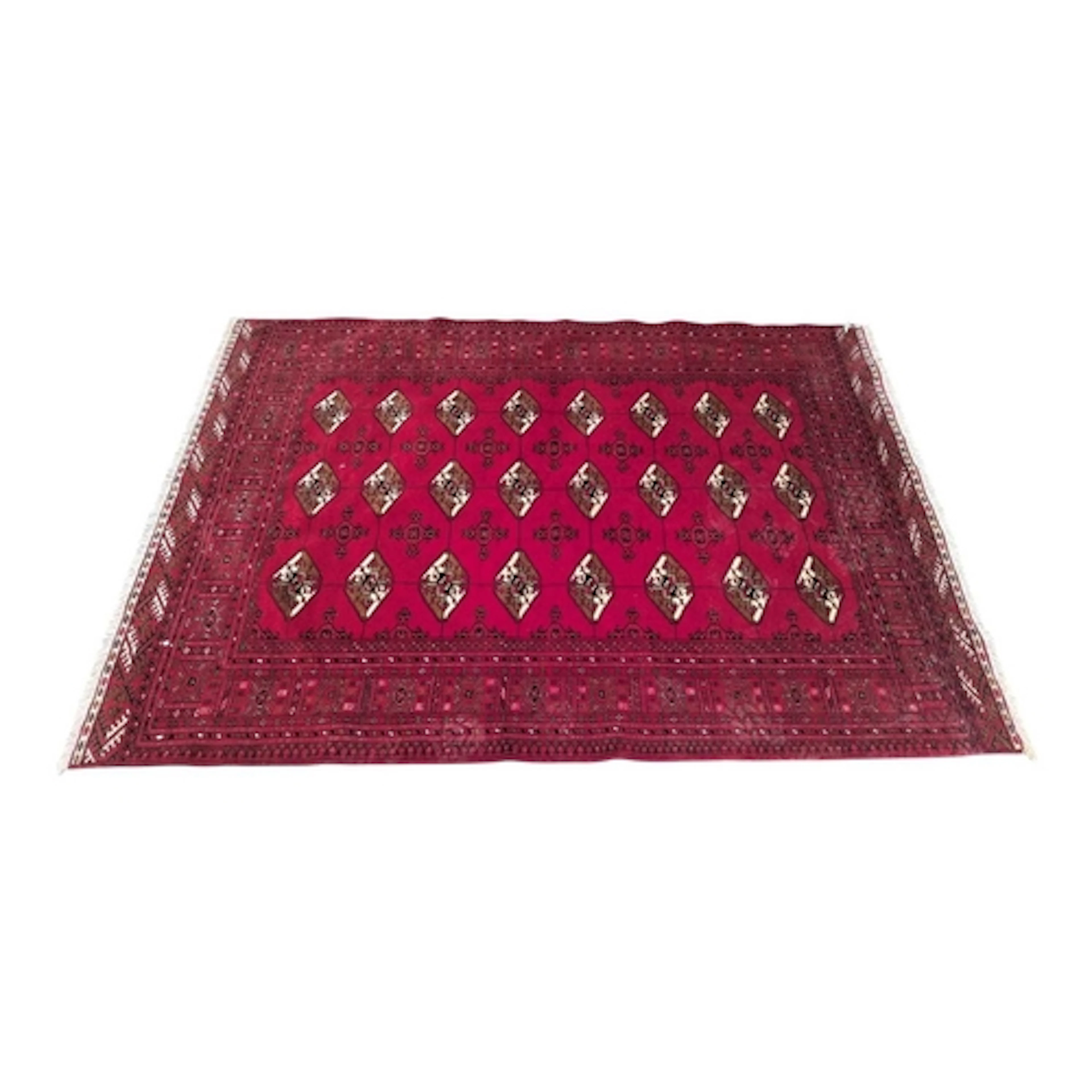 A Persian / Islamic 20th century Bokhara woollen floor carpe...