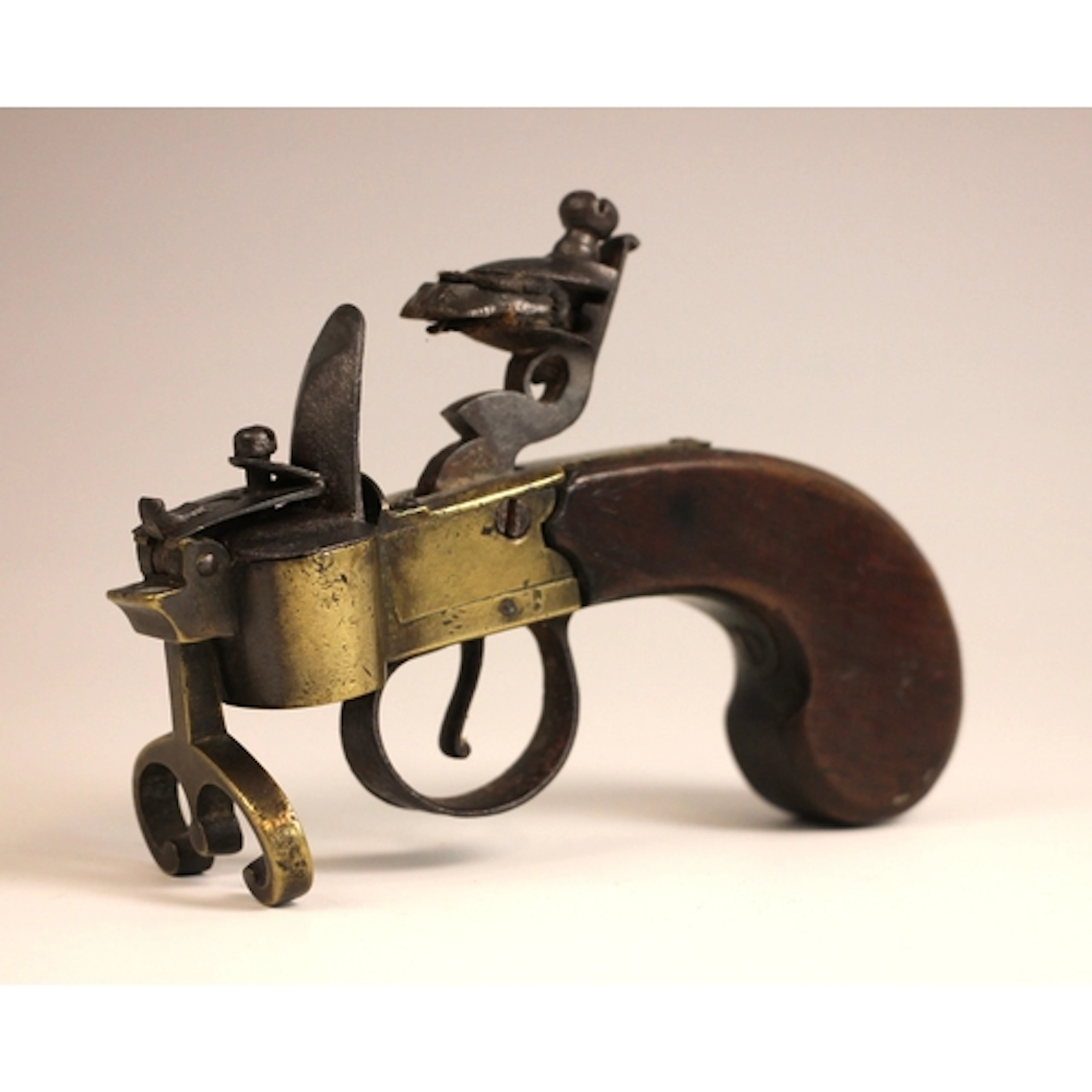 A flintlock tinder pistol in the manner of Dunhill, of typic...